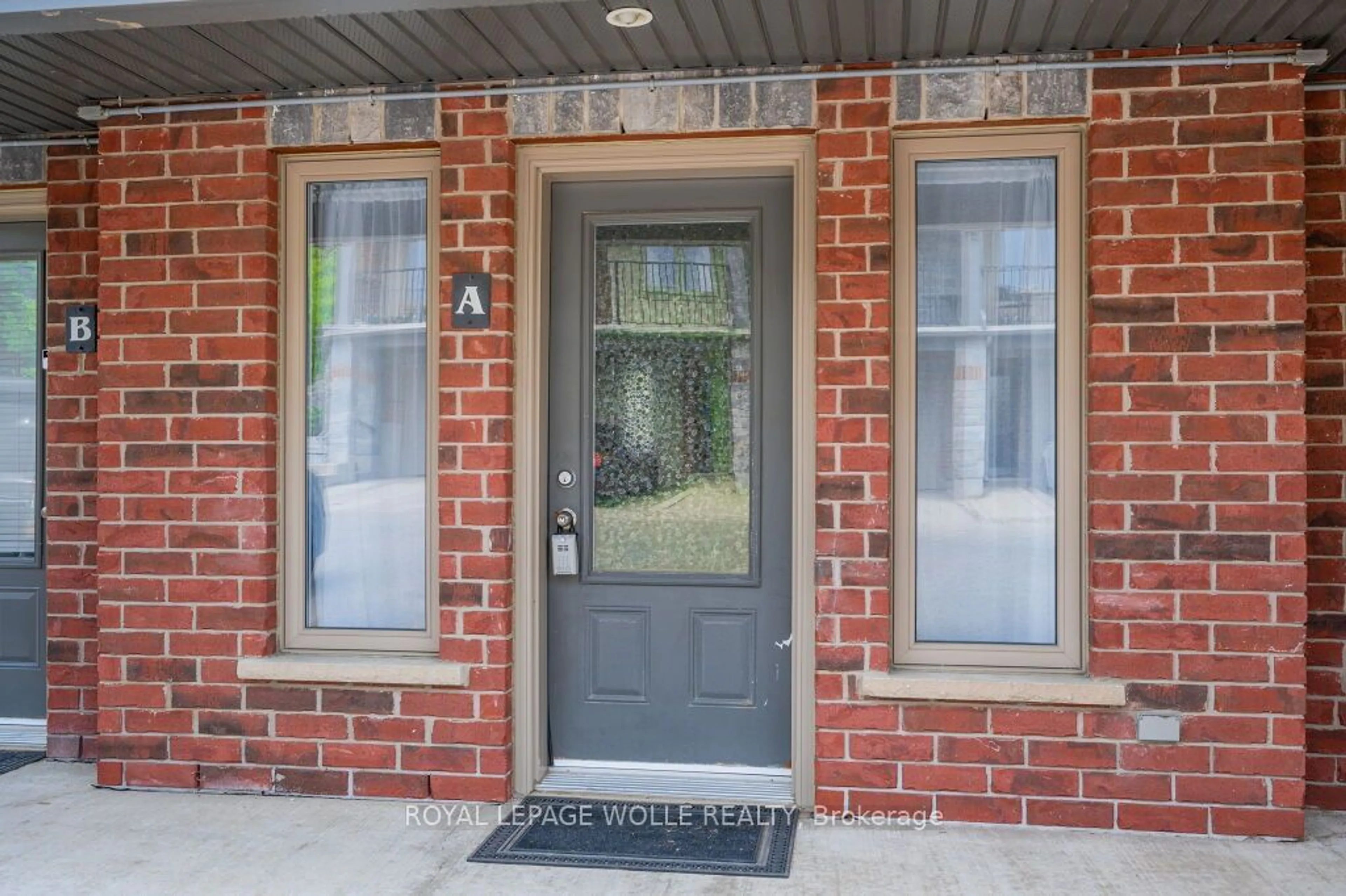 Home with brick exterior material, street for 489 East Ave #A, Kitchener Ontario N2H 1Z7