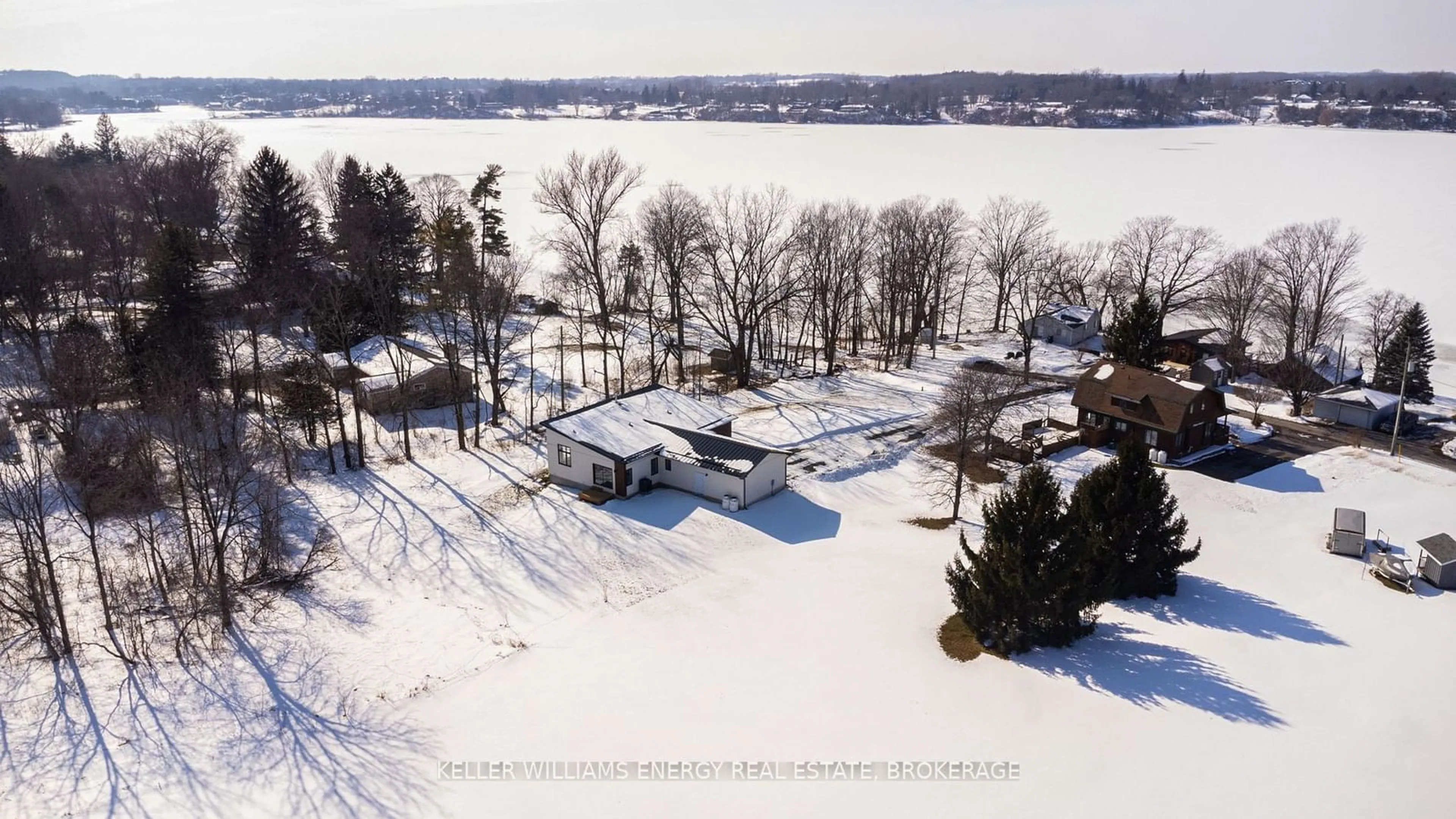 A pic from outside/outdoor area/front of a property/back of a property/a pic from drone, water/lake/river/ocean view for 85 Cedar Lane, Prince Edward County Ontario K0K 2T0