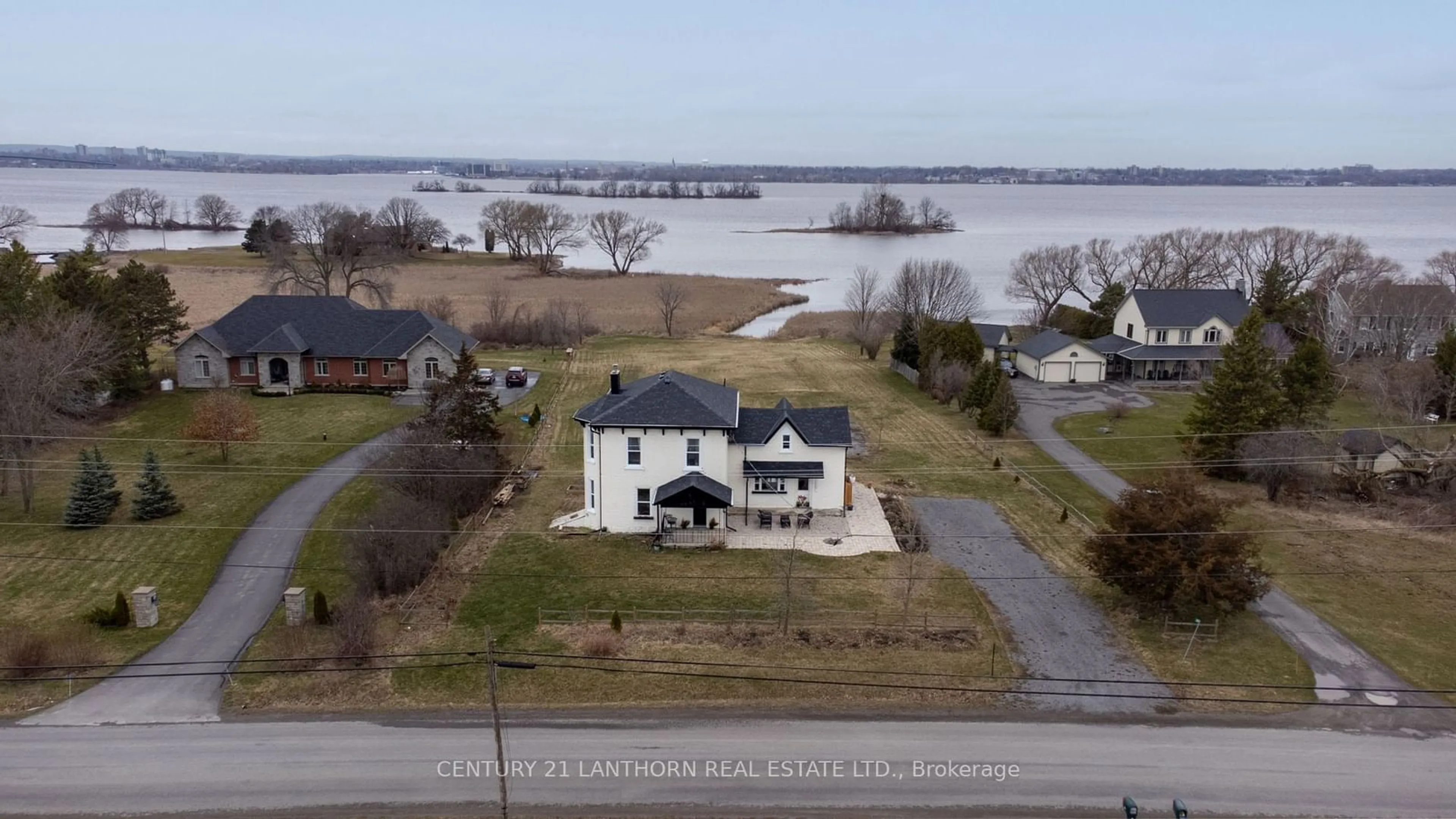 A pic from outside/outdoor area/front of a property/back of a property/a pic from drone, water/lake/river/ocean view for 395 Massassauga Rd, Prince Edward County Ontario K8N 4Z7