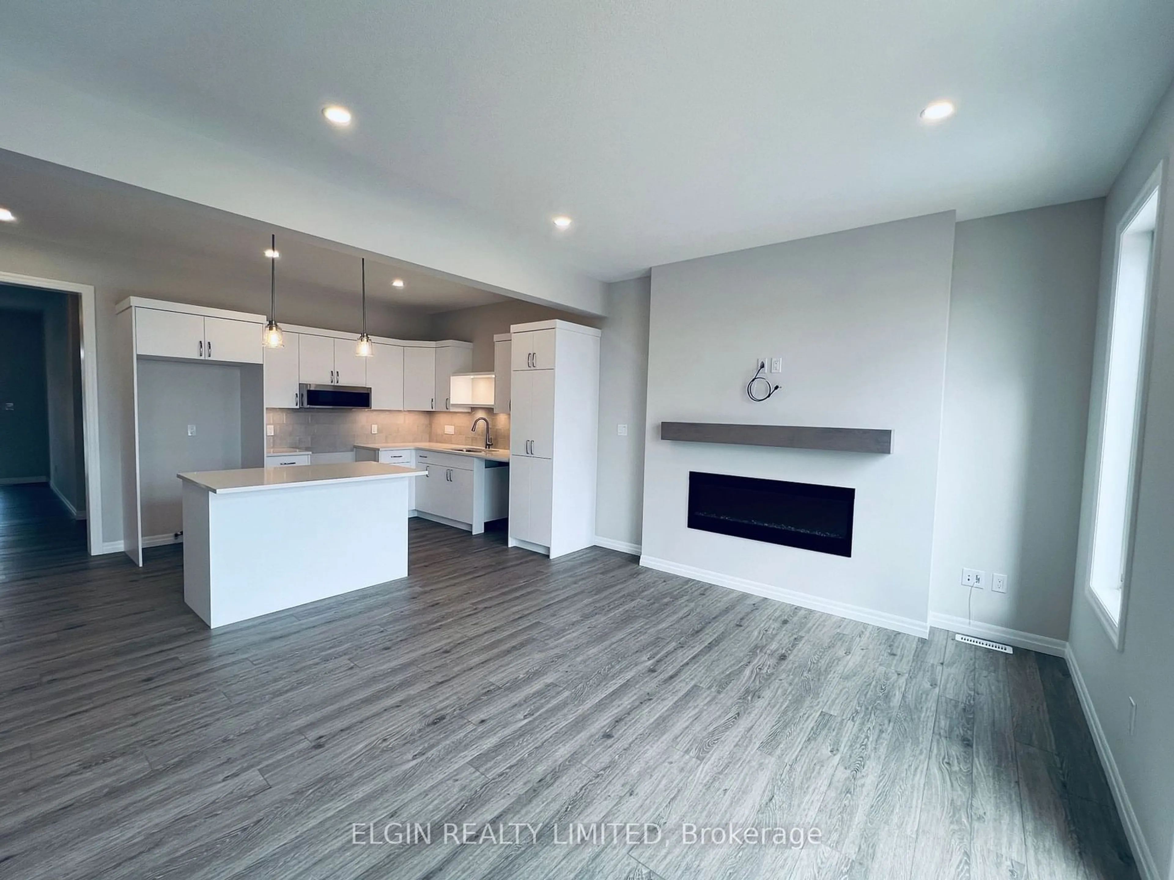 Open concept kitchen, wood/laminate floor for 227 Renaissance Dr, St. Thomas Ontario N5R 0P9