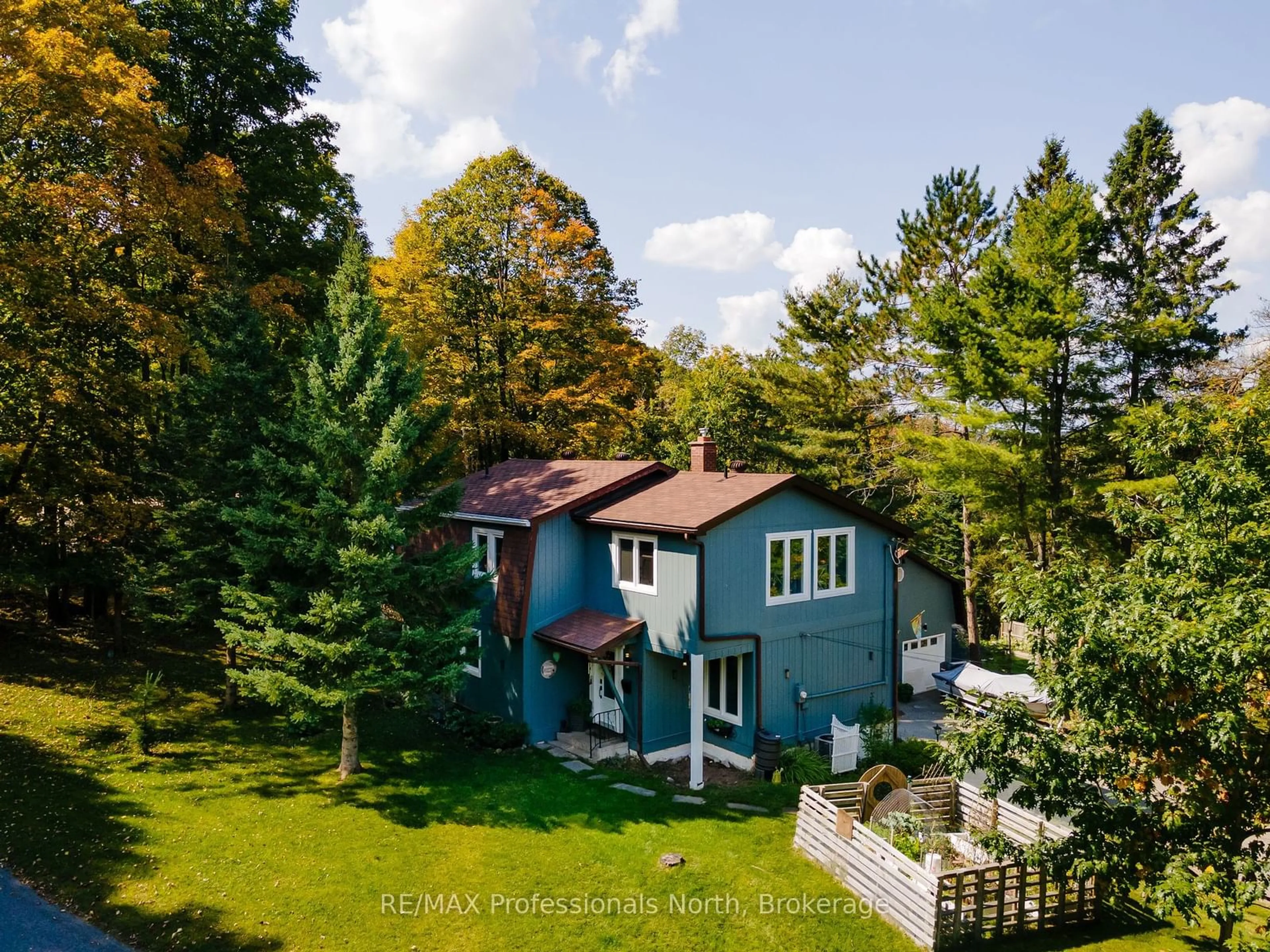 A pic from outside/outdoor area/front of a property/back of a property/a pic from drone, forest/trees view for 560 Mountain St, Dysart et al Ontario K0M 1S0