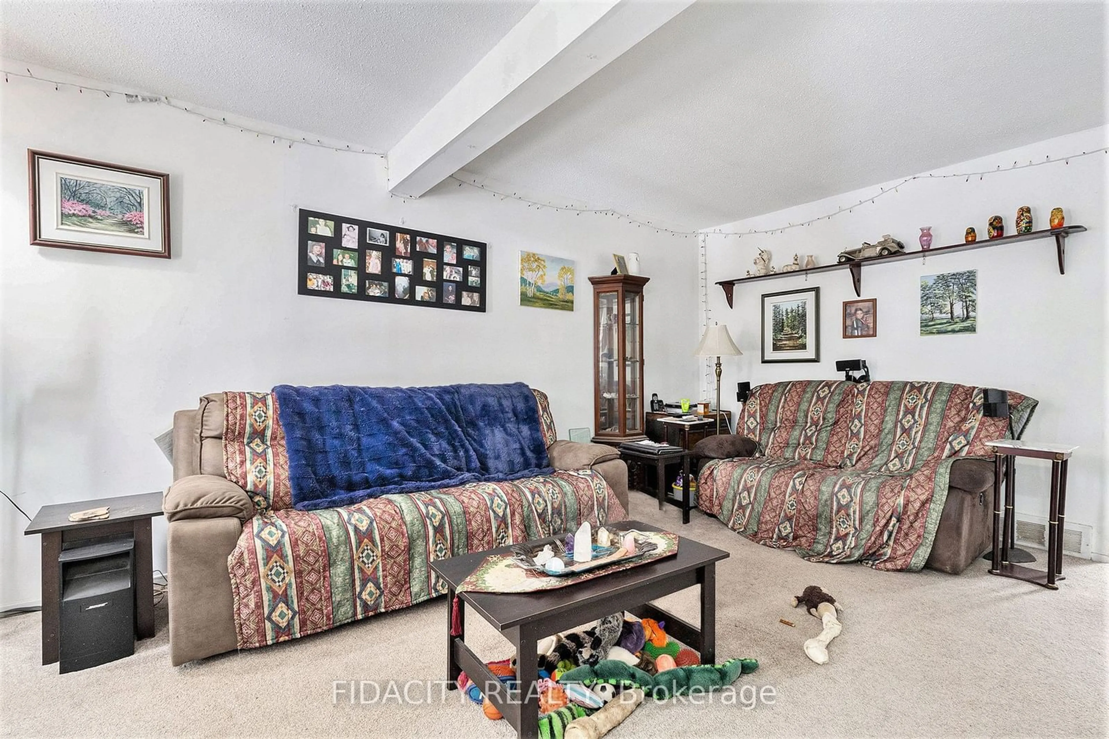 Living room with furniture, unknown for 3230 Uplands Dr #6, Hunt Club - Windsor Park Village and Area Ontario K1V 0C6