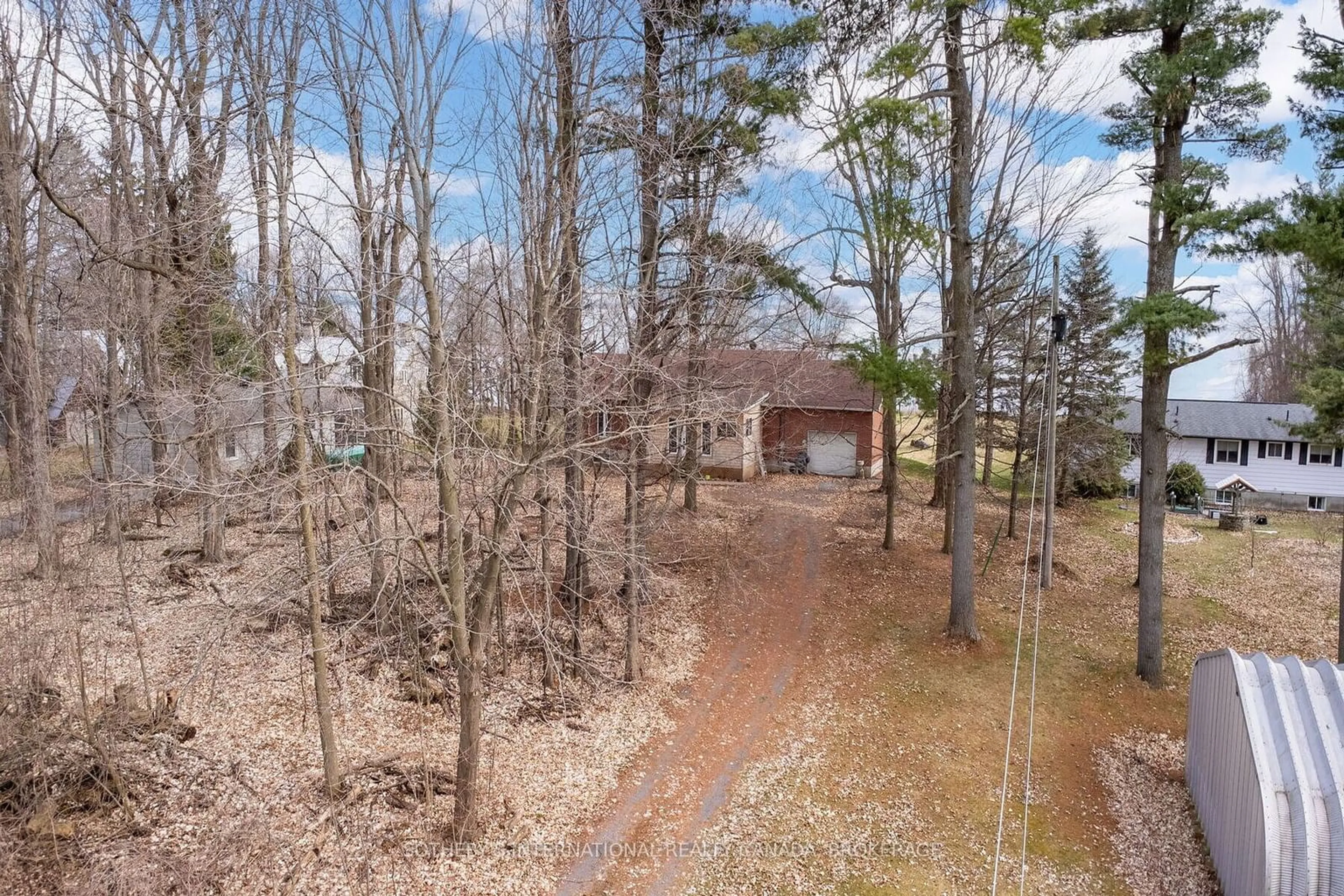 A pic from outside/outdoor area/front of a property/back of a property/a pic from drone, forest/trees view for 20820 South Service Rd, South Glengarry Ontario K0C 1N0