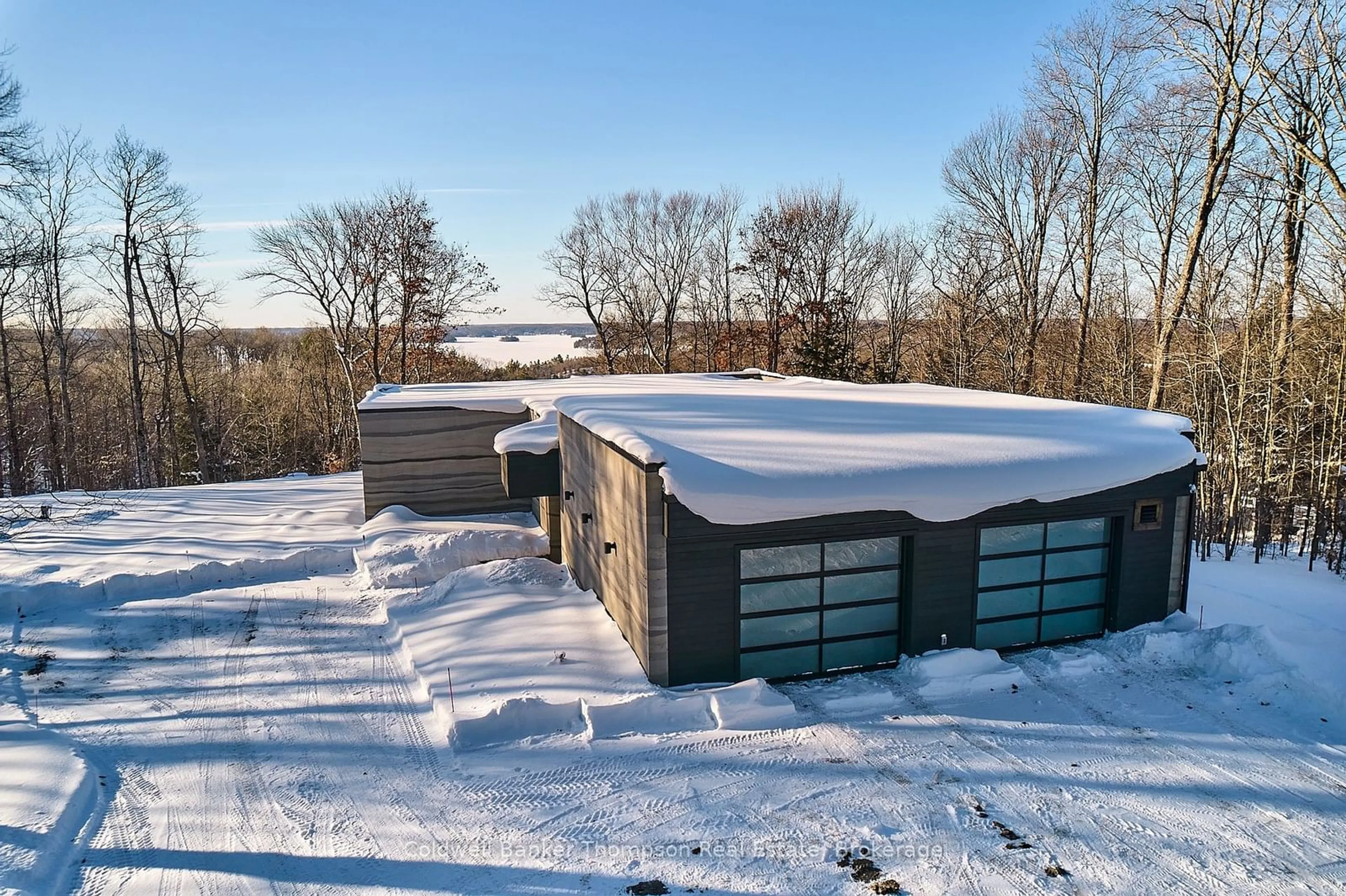 A pic from outside/outdoor area/front of a property/back of a property/a pic from drone, unknown for 100 Gryffin Bluffs Lane #16, Huntsville Ontario P0B 1M0