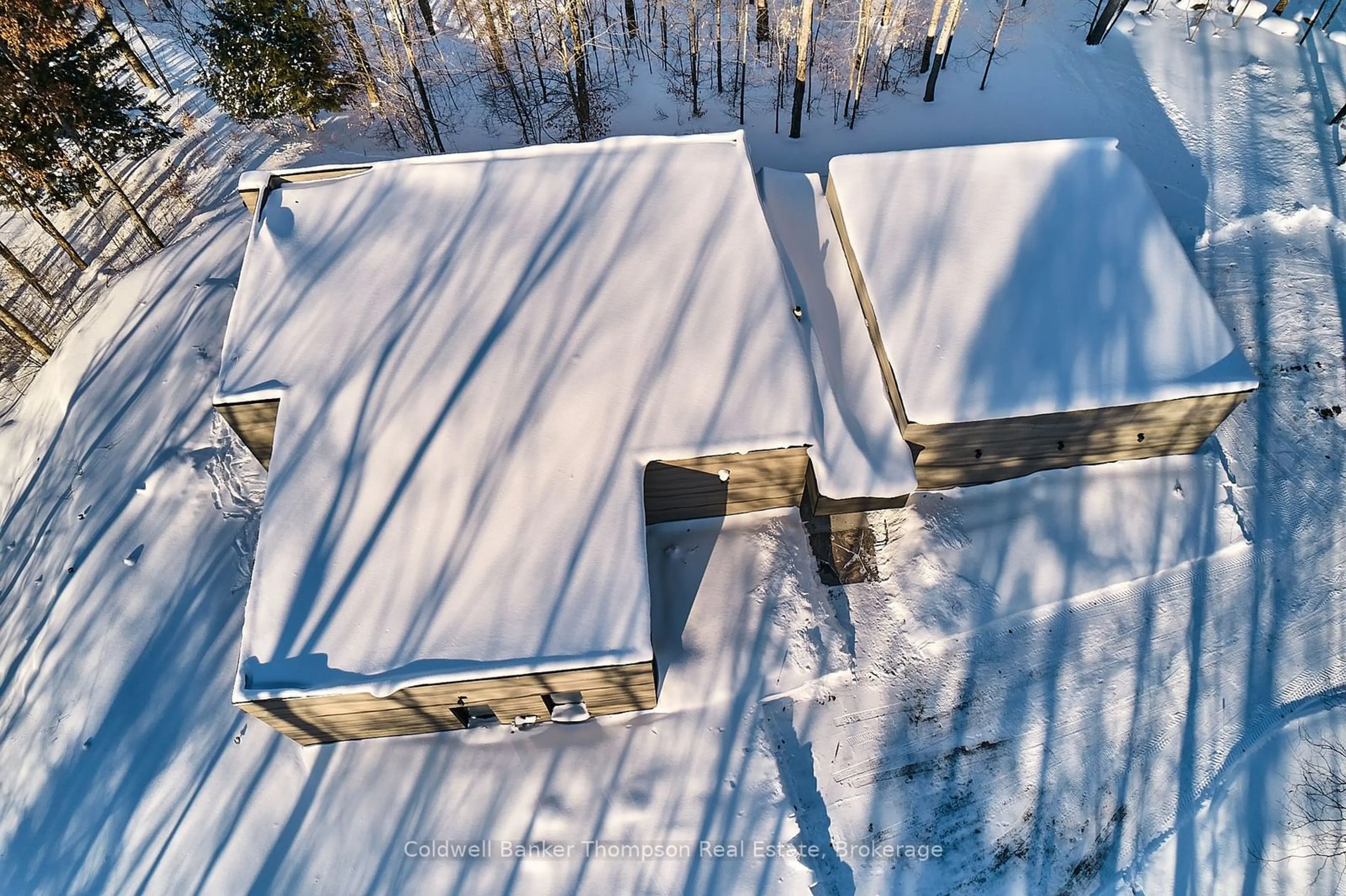 A pic from outside/outdoor area/front of a property/back of a property/a pic from drone, building for 100 Gryffin Bluffs Lane #16, Huntsville Ontario P0B 1M0