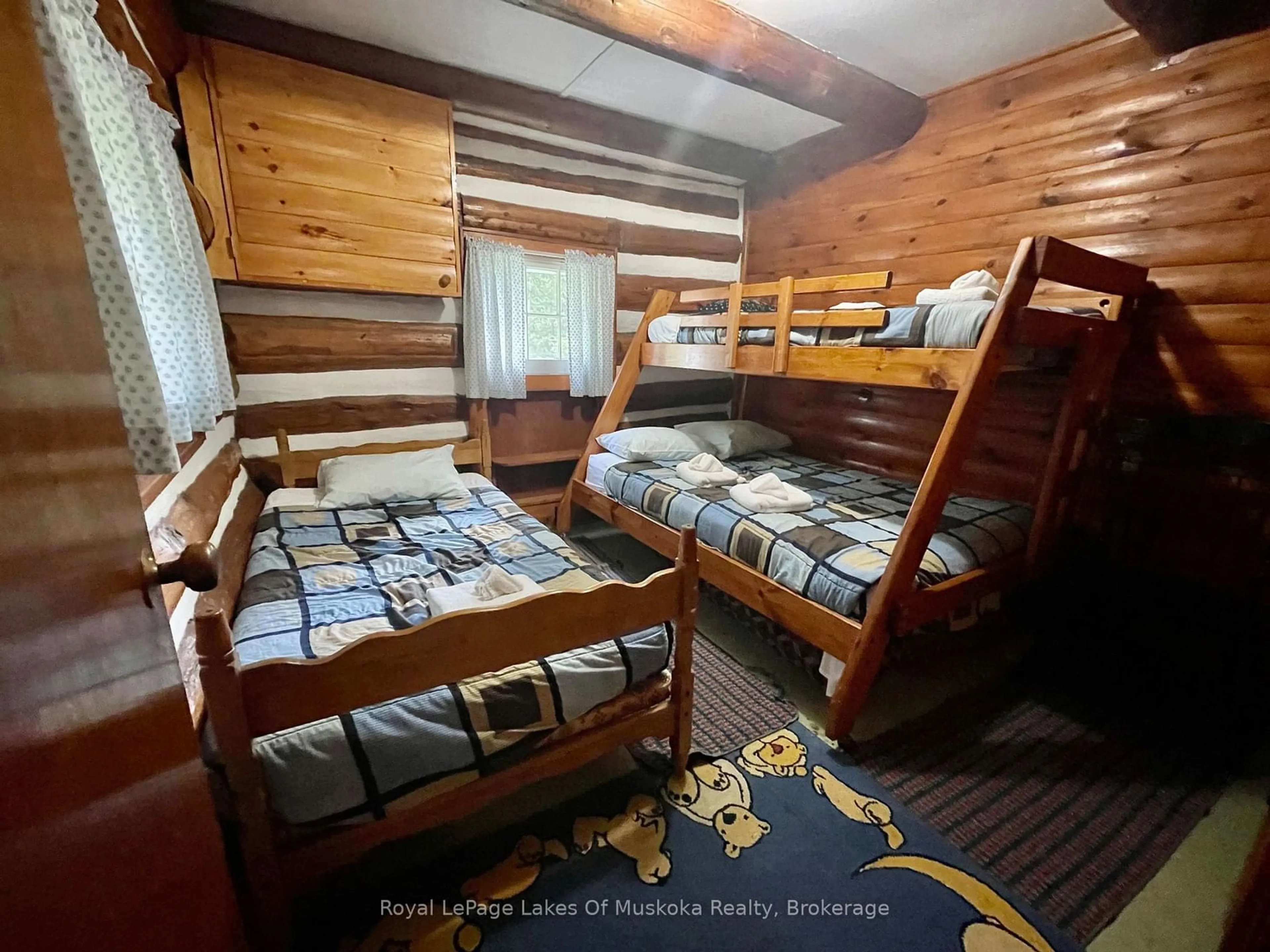 Bedroom with bed, wood/laminate floor for 1341 BILLIE BEAR Rd #5, Lake of Bays Ontario P1H 2J6