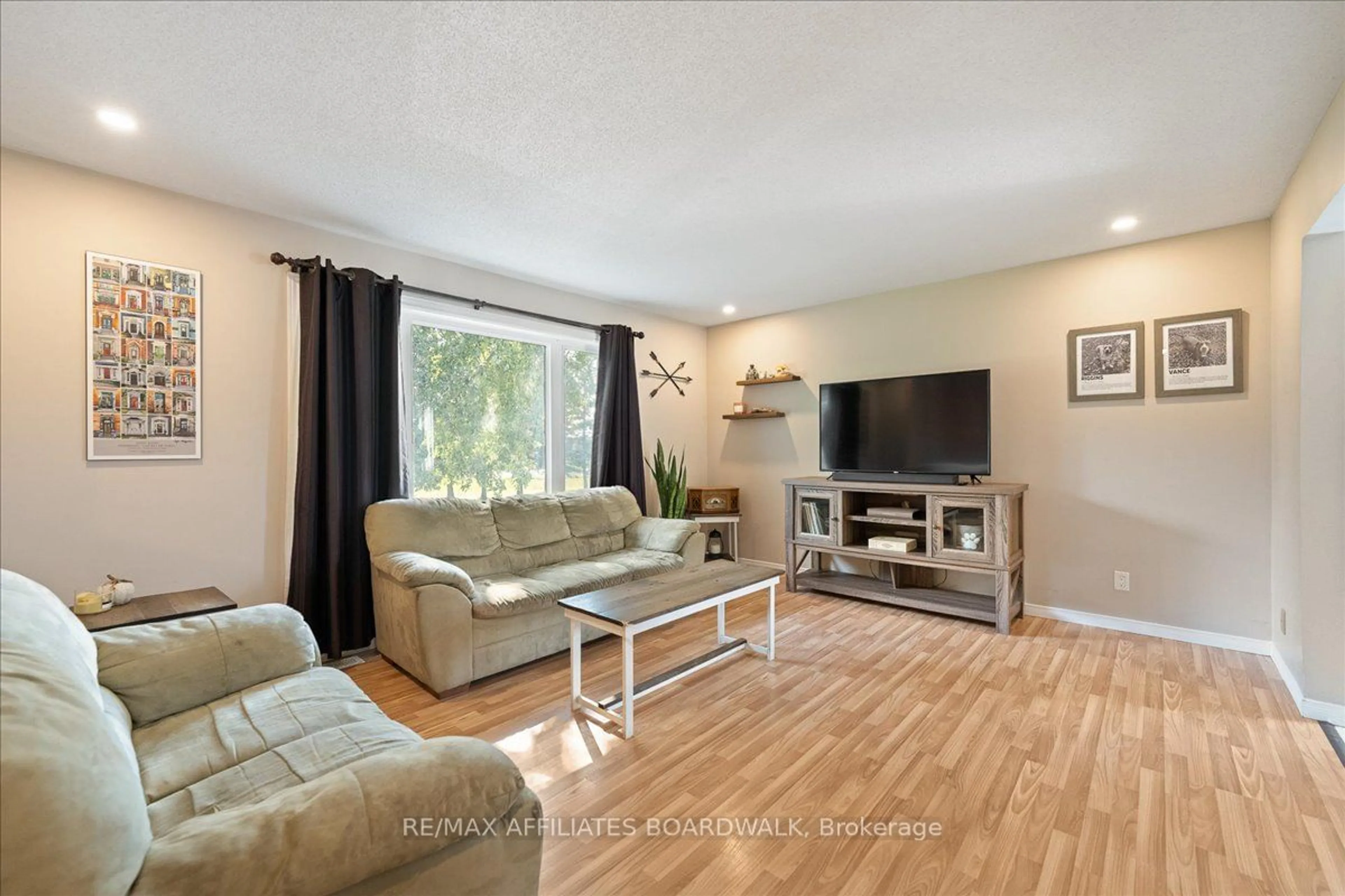 Living room with furniture, wood/laminate floor for 15679 County 43 Rd, North Stormont Ontario K0C 1K0