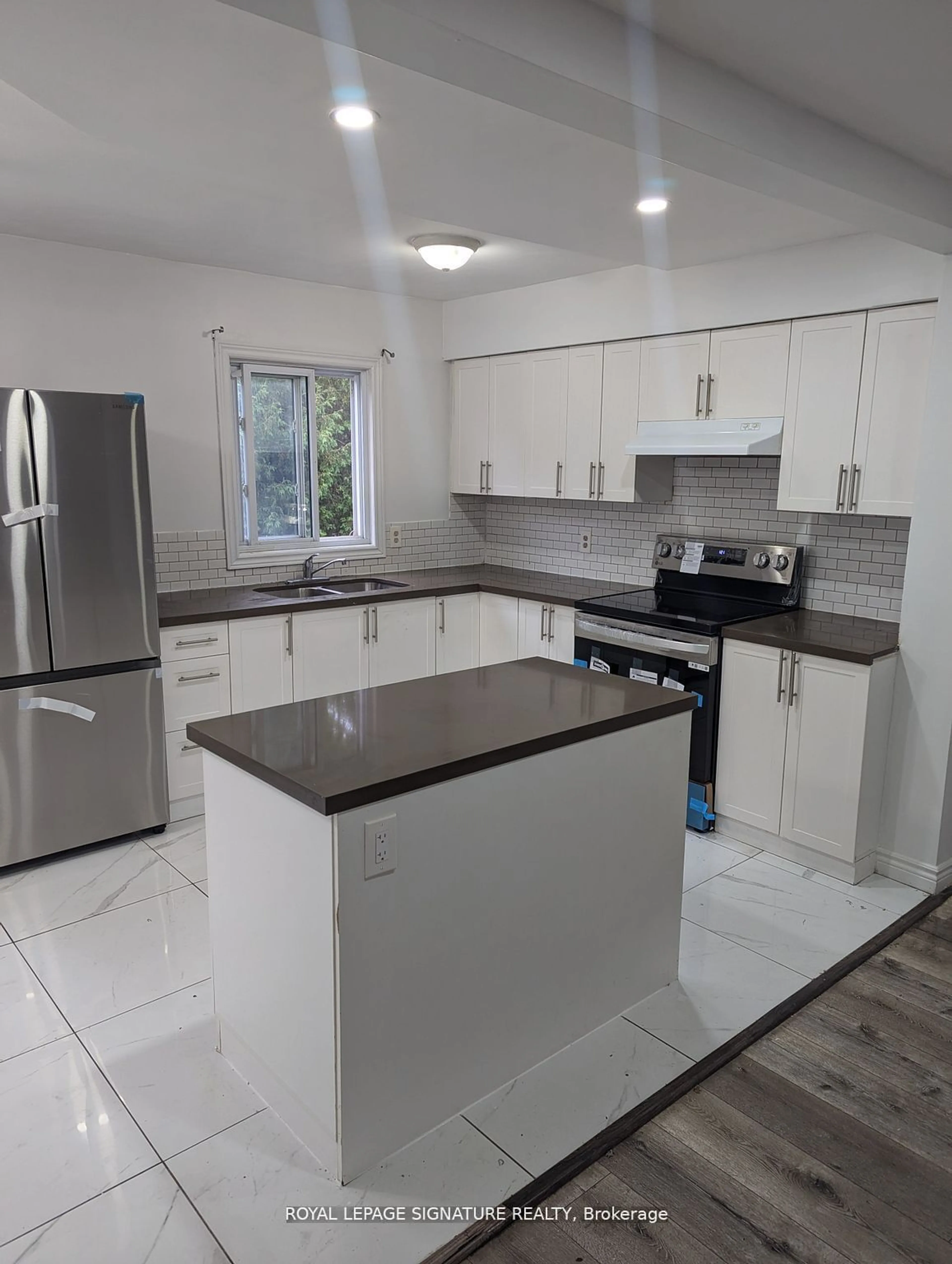 Open concept kitchen, ceramic/tile floor for 577 Third St #29, London Ontario N5V 4B9