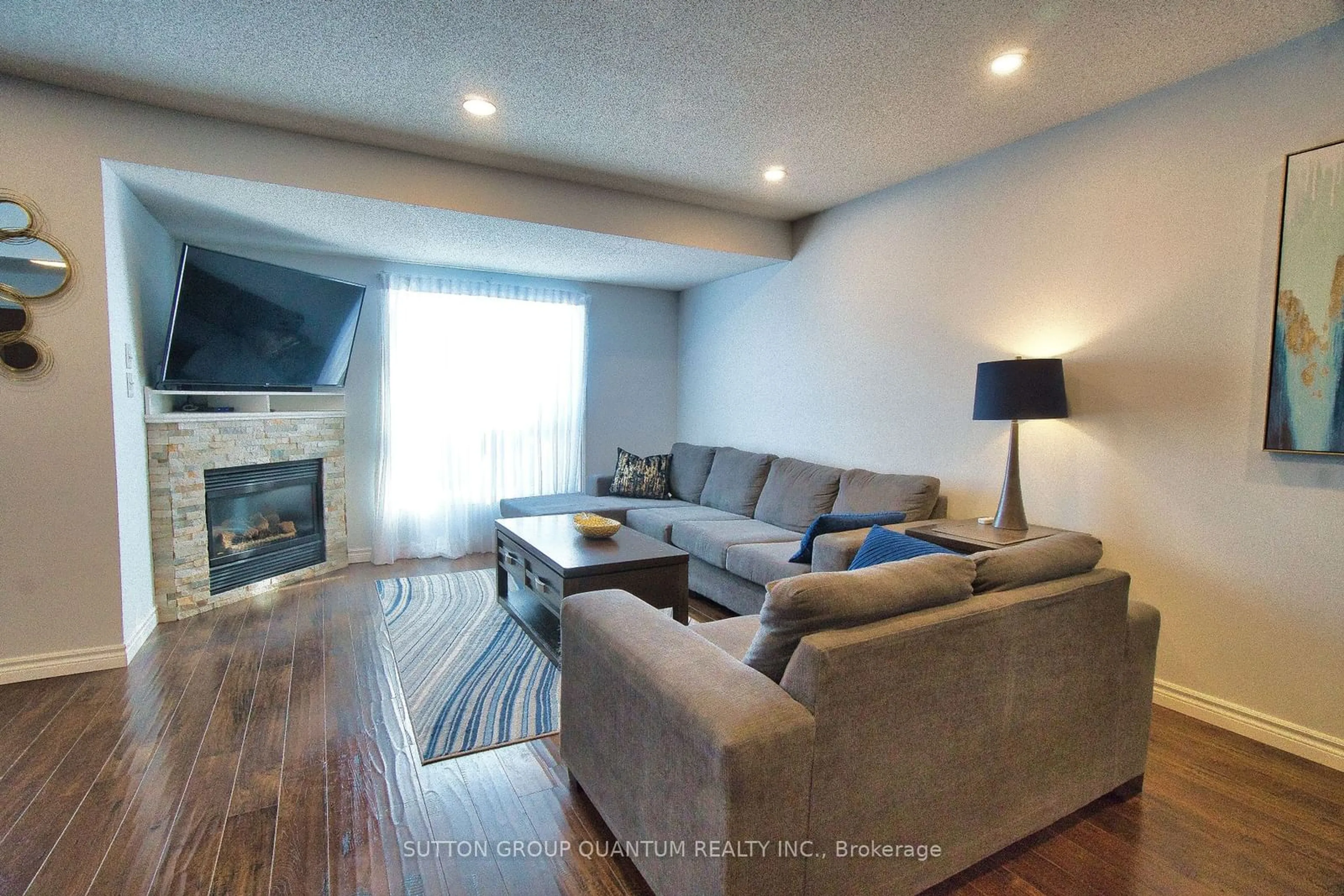 Living room with furniture, wood/laminate floor for 121 Lee St, Guelph Ontario N1E 7E8