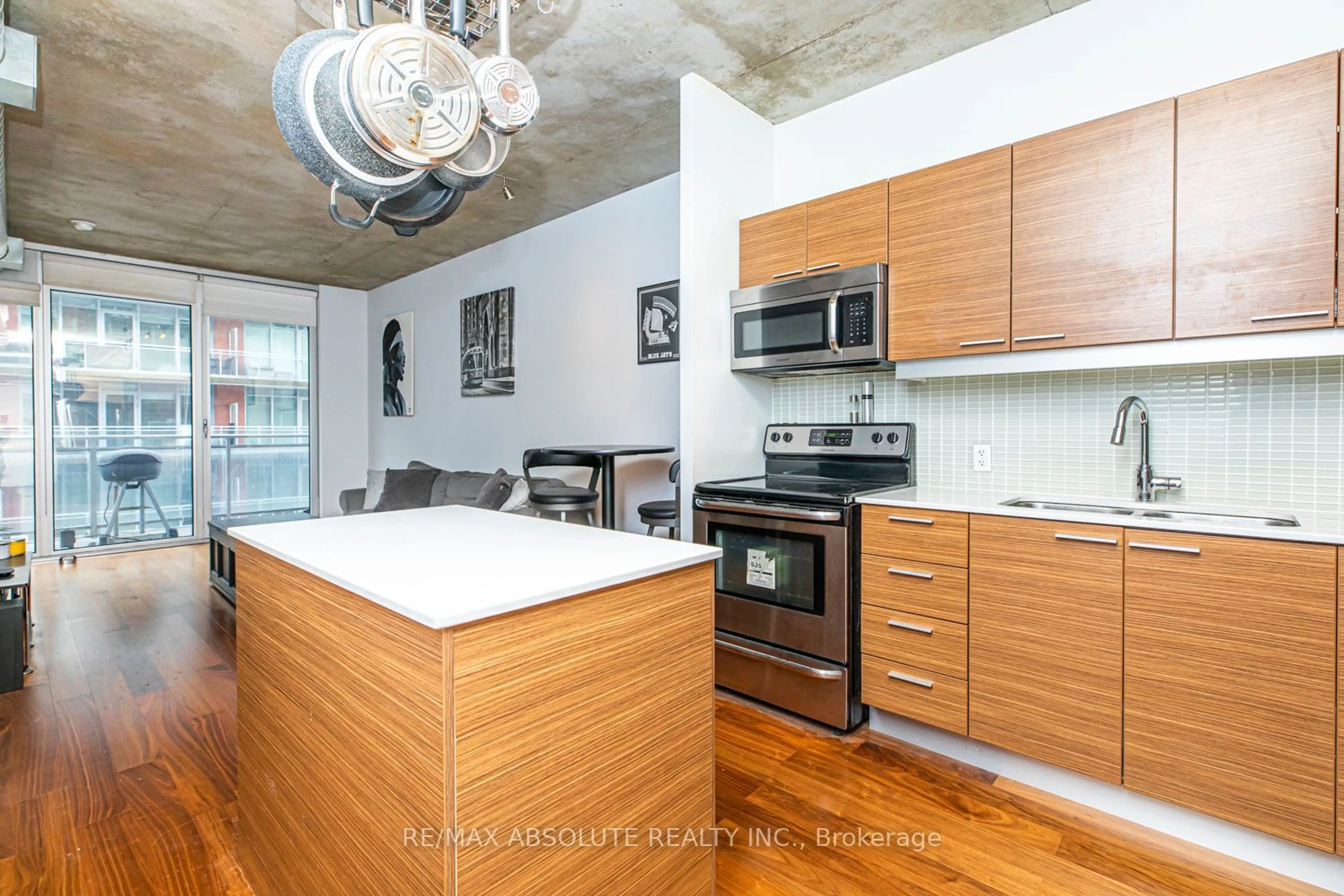 Open concept kitchen, cement floor for 349 Mcleod St #422, Ottawa Centre Ontario K2P 0S1