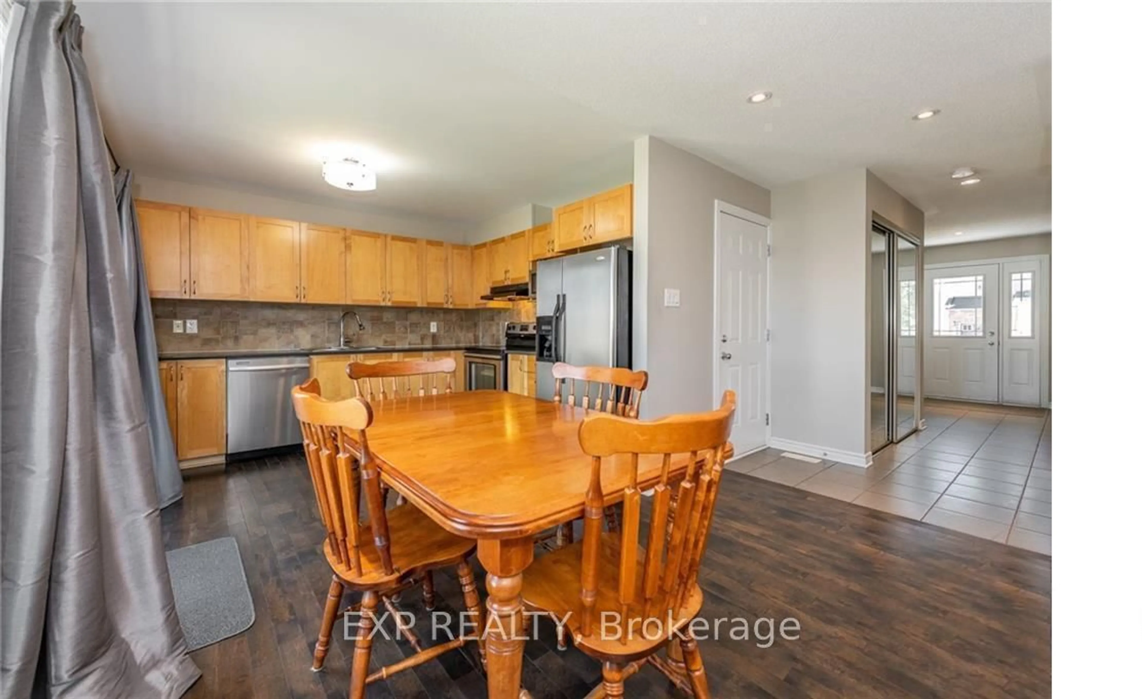 Open concept kitchen, wood/laminate floor for 113 Glendore St, Barrhaven Ontario K2J 0N1