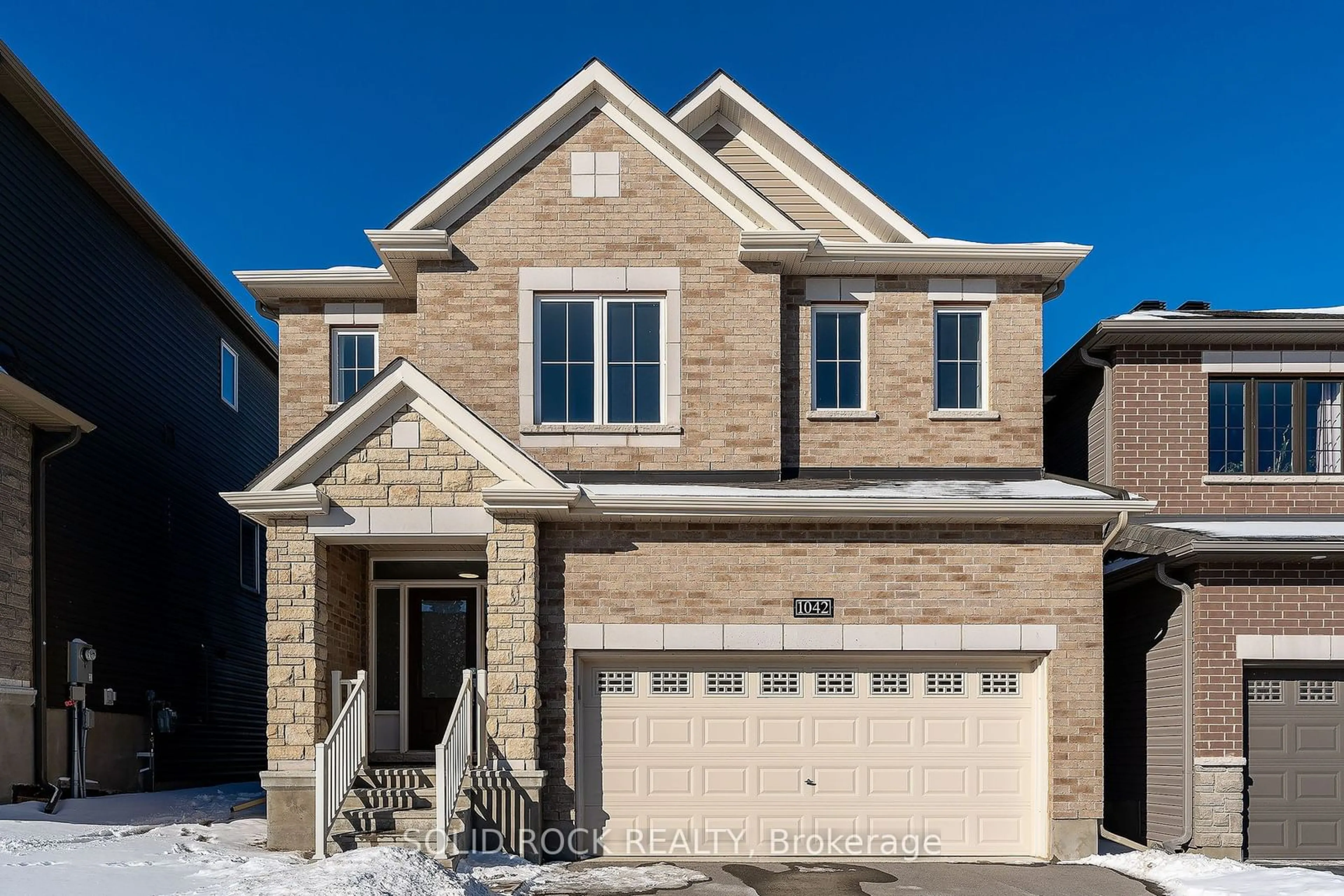 Home with brick exterior material, street for 1042 Kilbirnie Dr, Barrhaven Ontario K2J 6E6