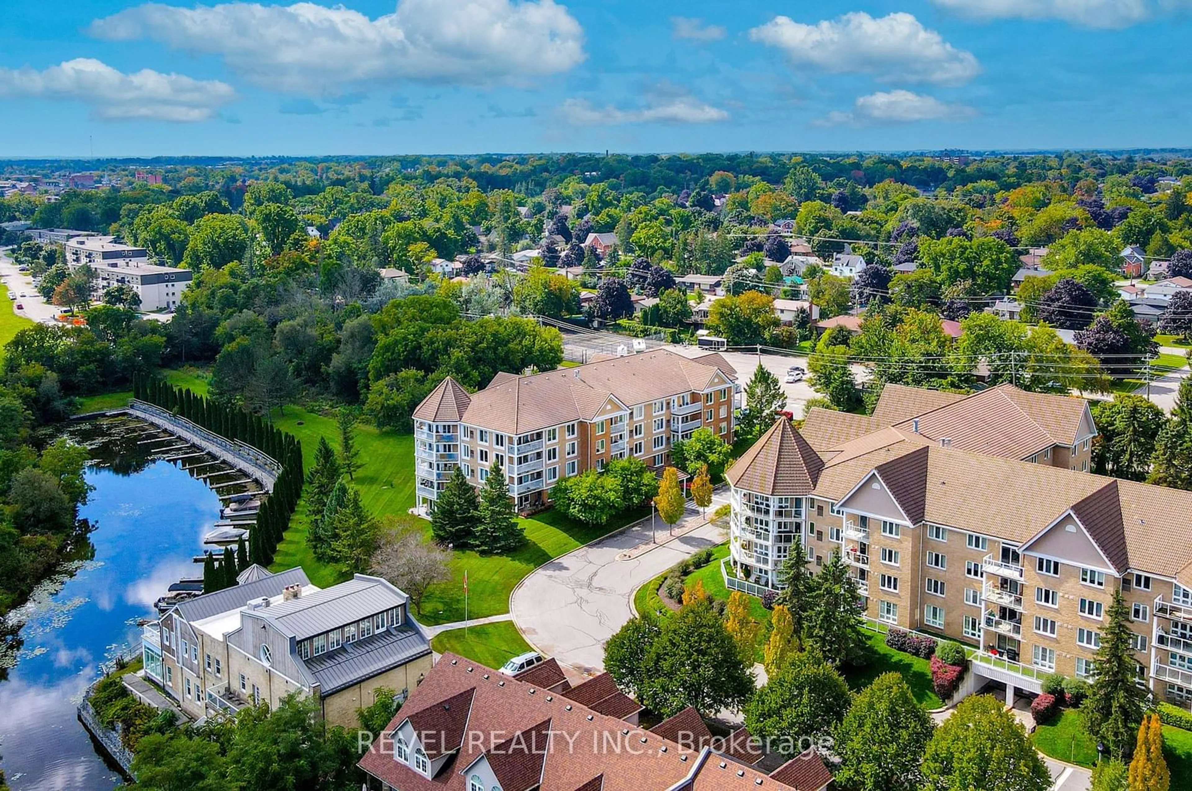 A pic from outside/outdoor area/front of a property/back of a property/a pic from drone, city buildings view from balcony for 50 RIVERMILL Blvd #102, Kawartha Lakes Ontario K9V 6C1