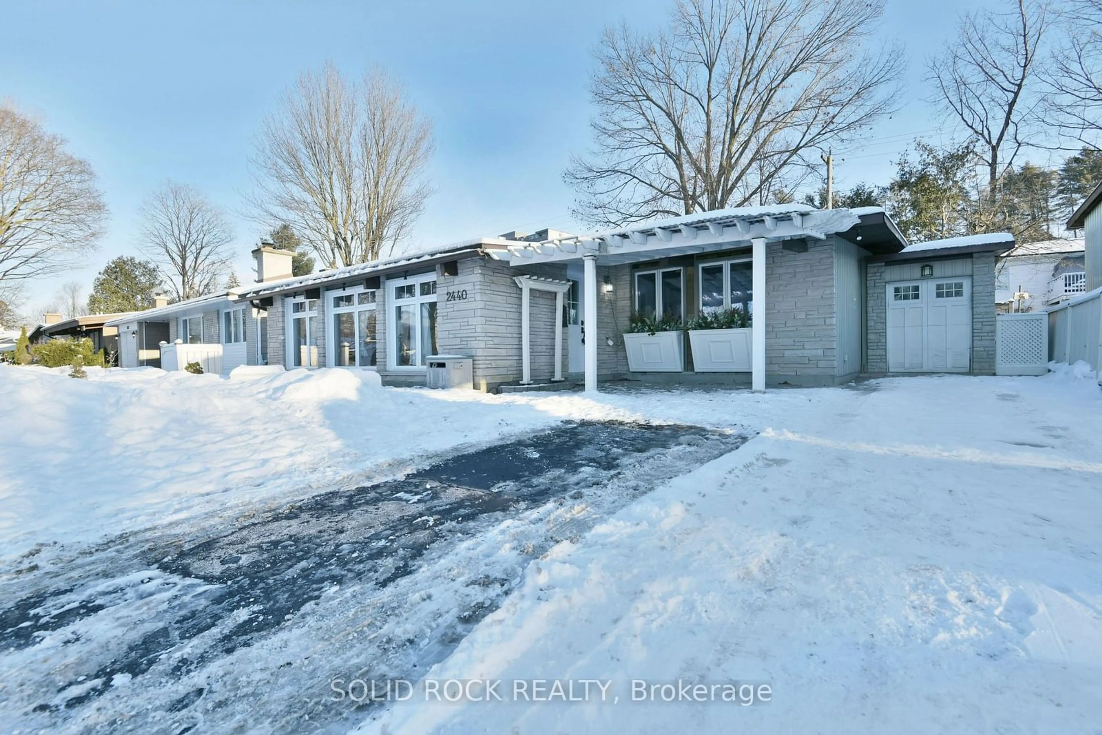 A pic from outside/outdoor area/front of a property/back of a property/a pic from drone, street for 2440 Thorson Ave, Ottawa Ontario K2C 1M5