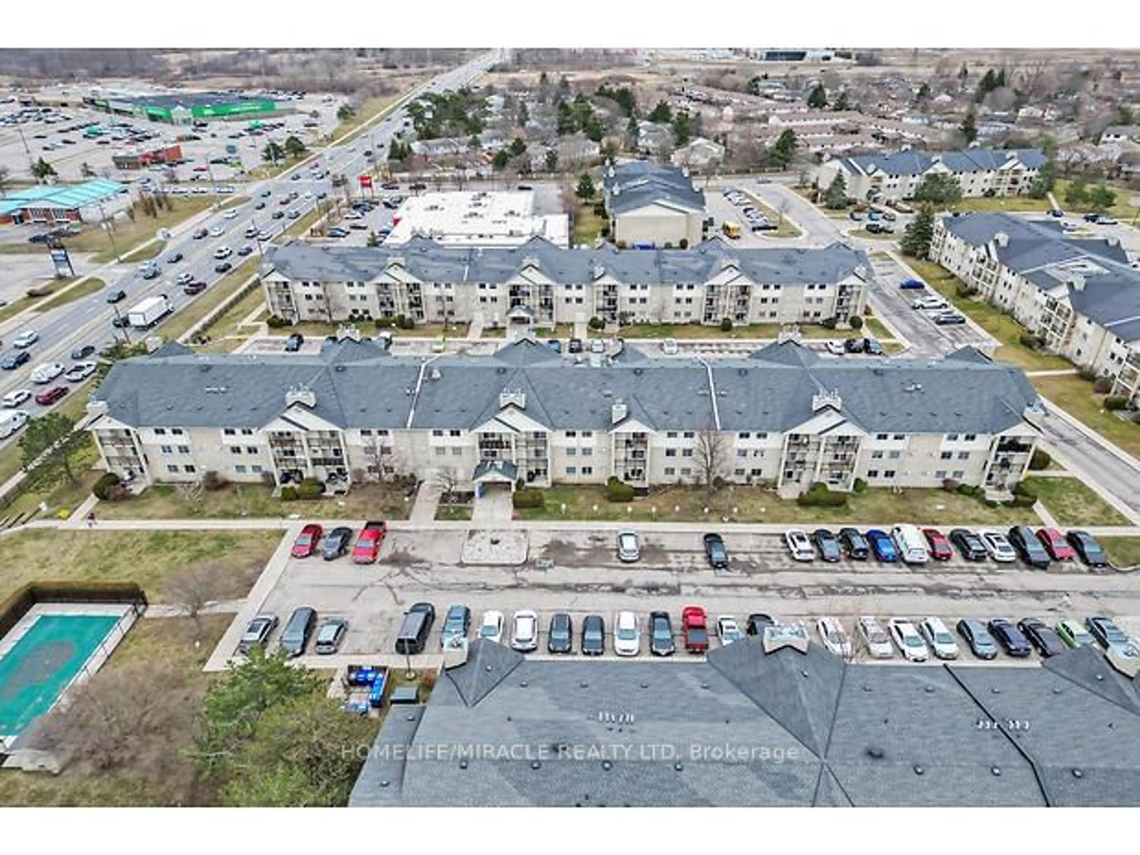 A pic from outside/outdoor area/front of a property/back of a property/a pic from drone, street for 731 Deveron Cres #305, London Ontario N5Z 4X6