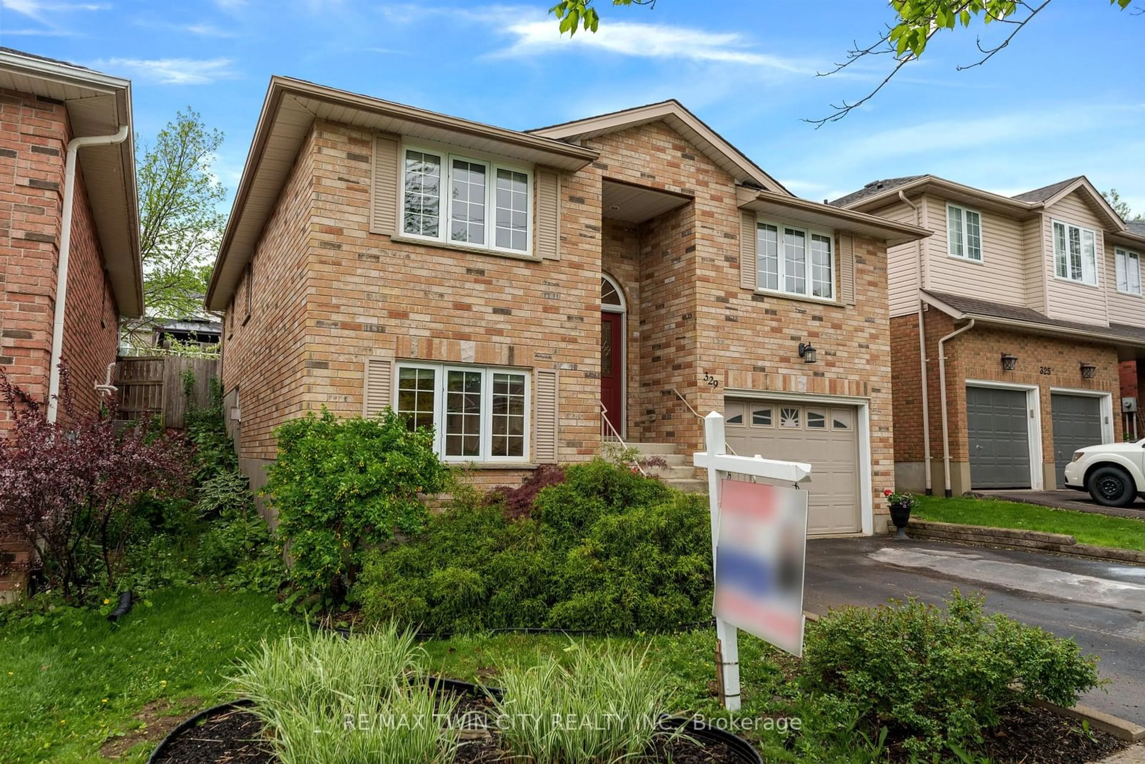 Home with brick exterior material, street for 329 Otterbein Rd, Kitchener Ontario N2B 3W1