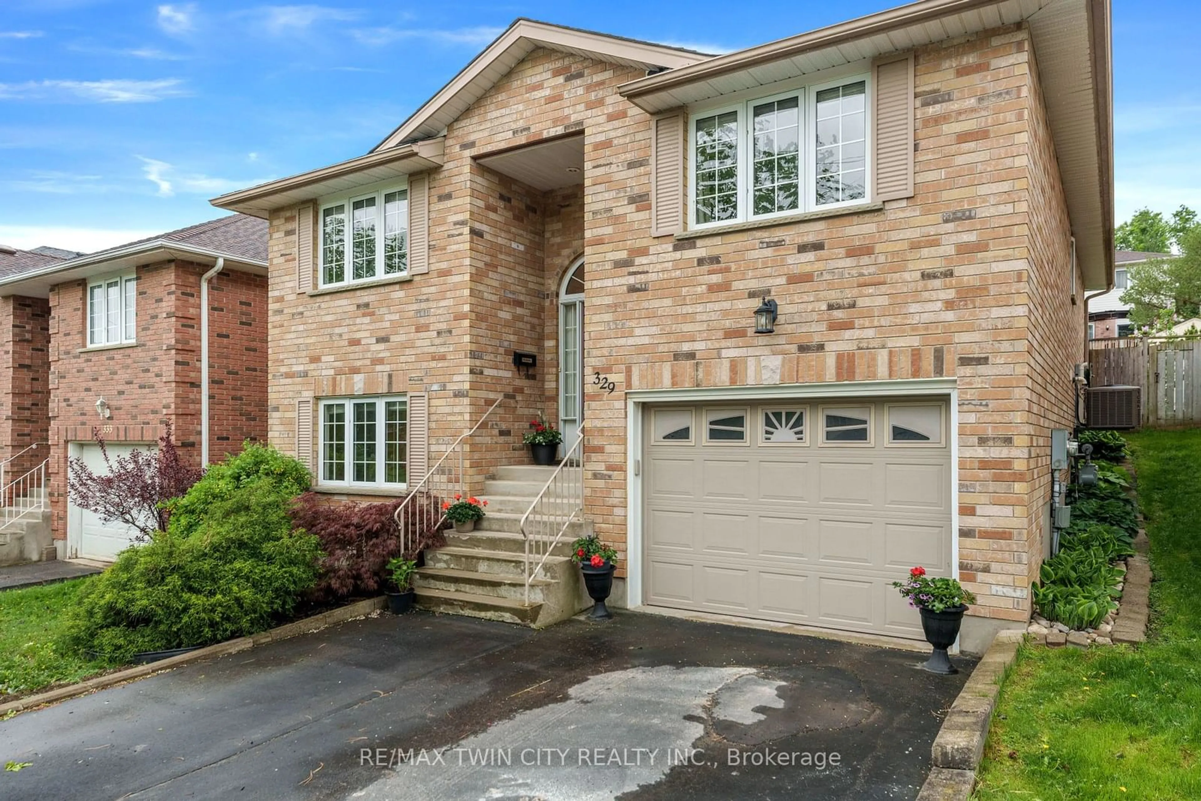 Home with brick exterior material, street for 329 Otterbein Rd, Kitchener Ontario N2B 3W1