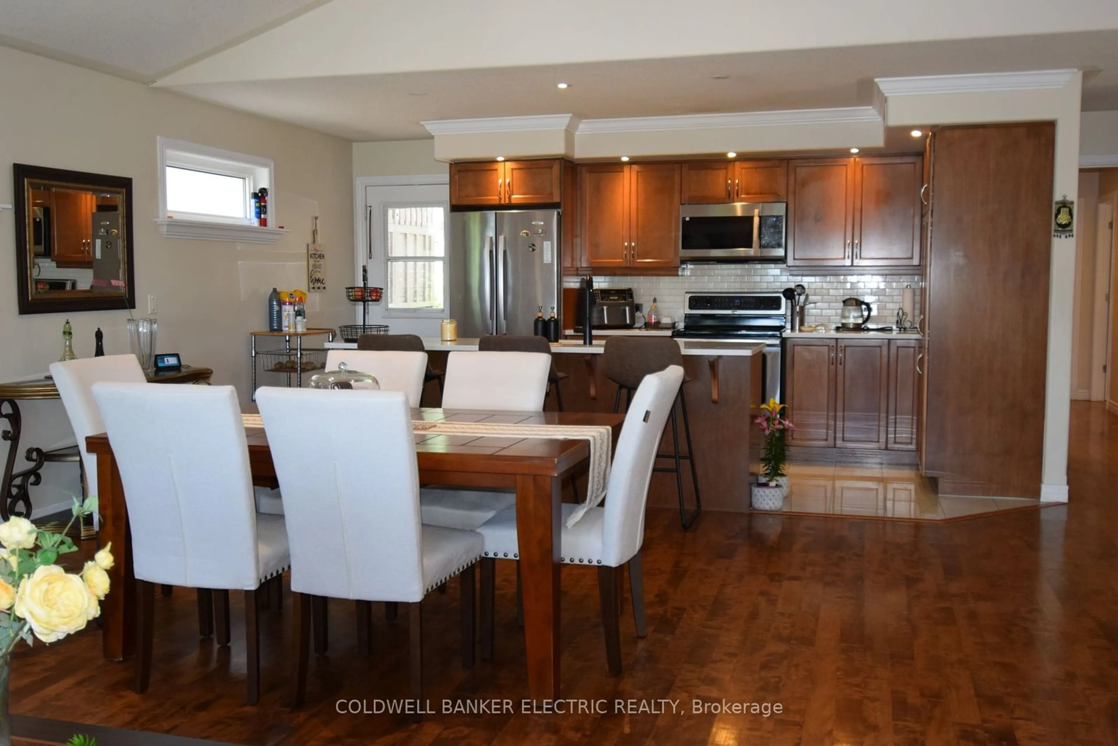 Open concept kitchen, wood/laminate floor for 105 Milroy Dr, Peterborough Ontario K9H 7T2