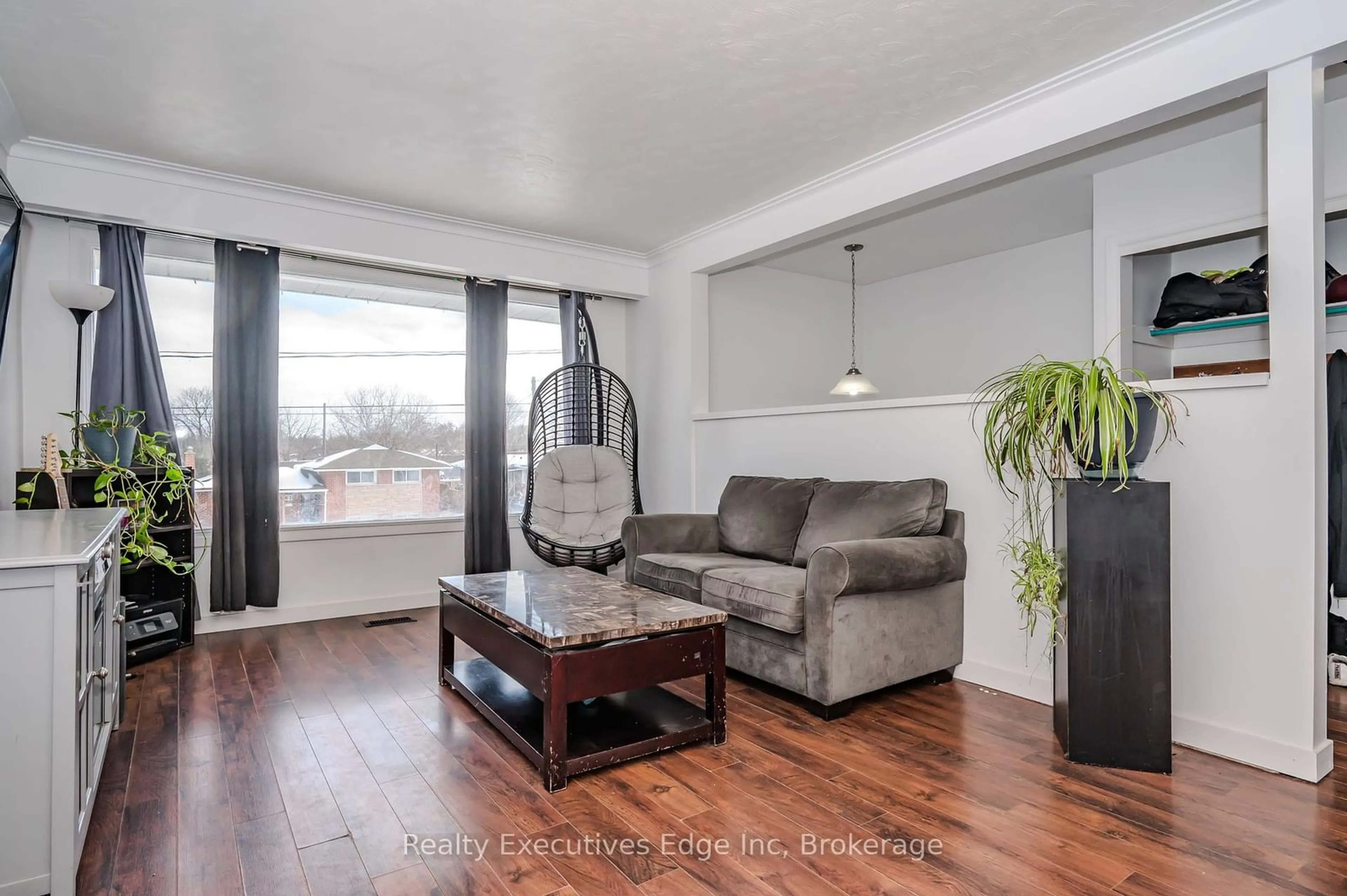 Living room with furniture, wood/laminate floor for 66 Rosewood Ave, Guelph Ontario N1H 6A1