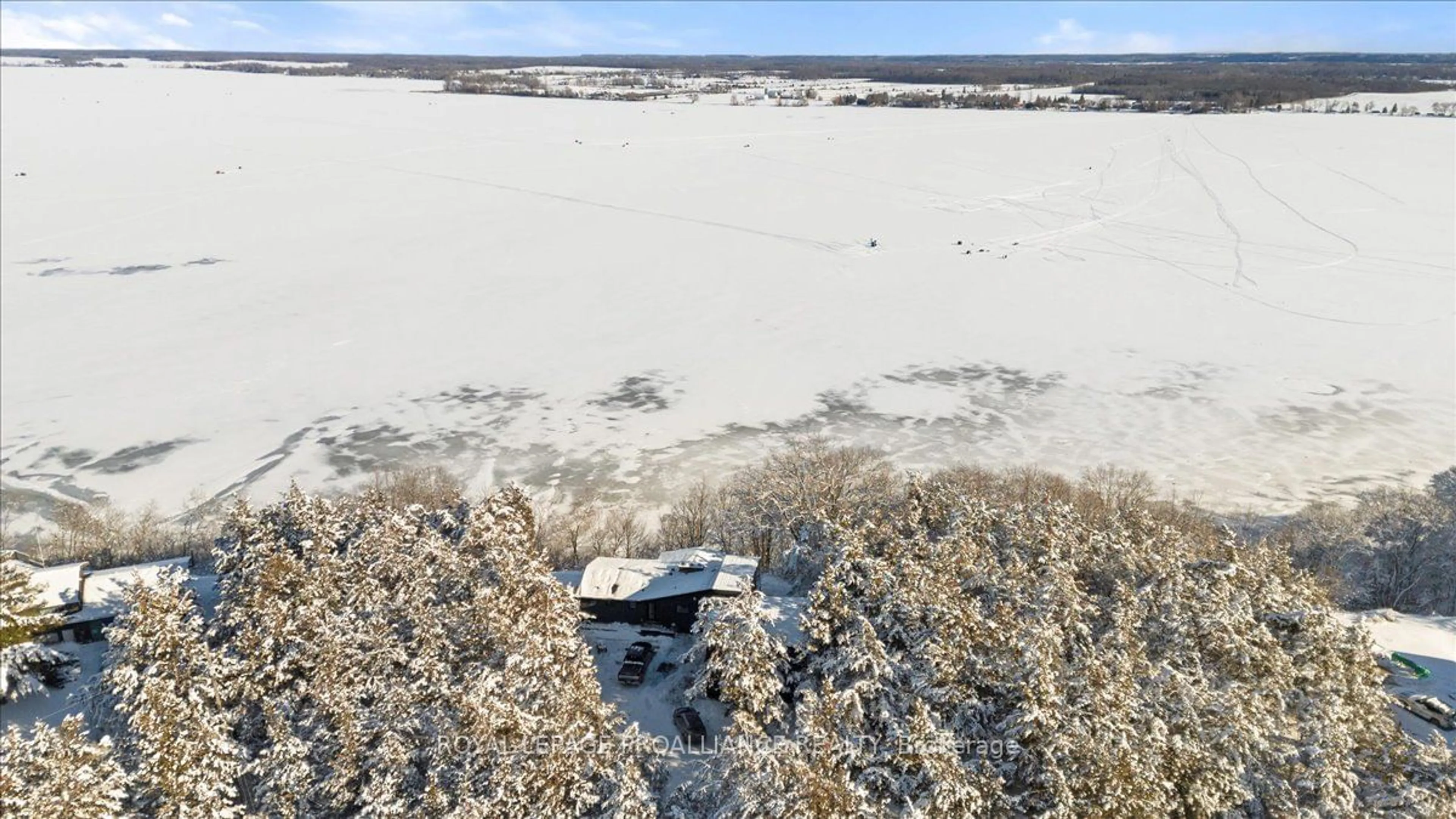 A pic from outside/outdoor area/front of a property/back of a property/a pic from drone, water/lake/river/ocean view for 23 Sidney Shore Lane, Prince Edward County Ontario K0K 2T0