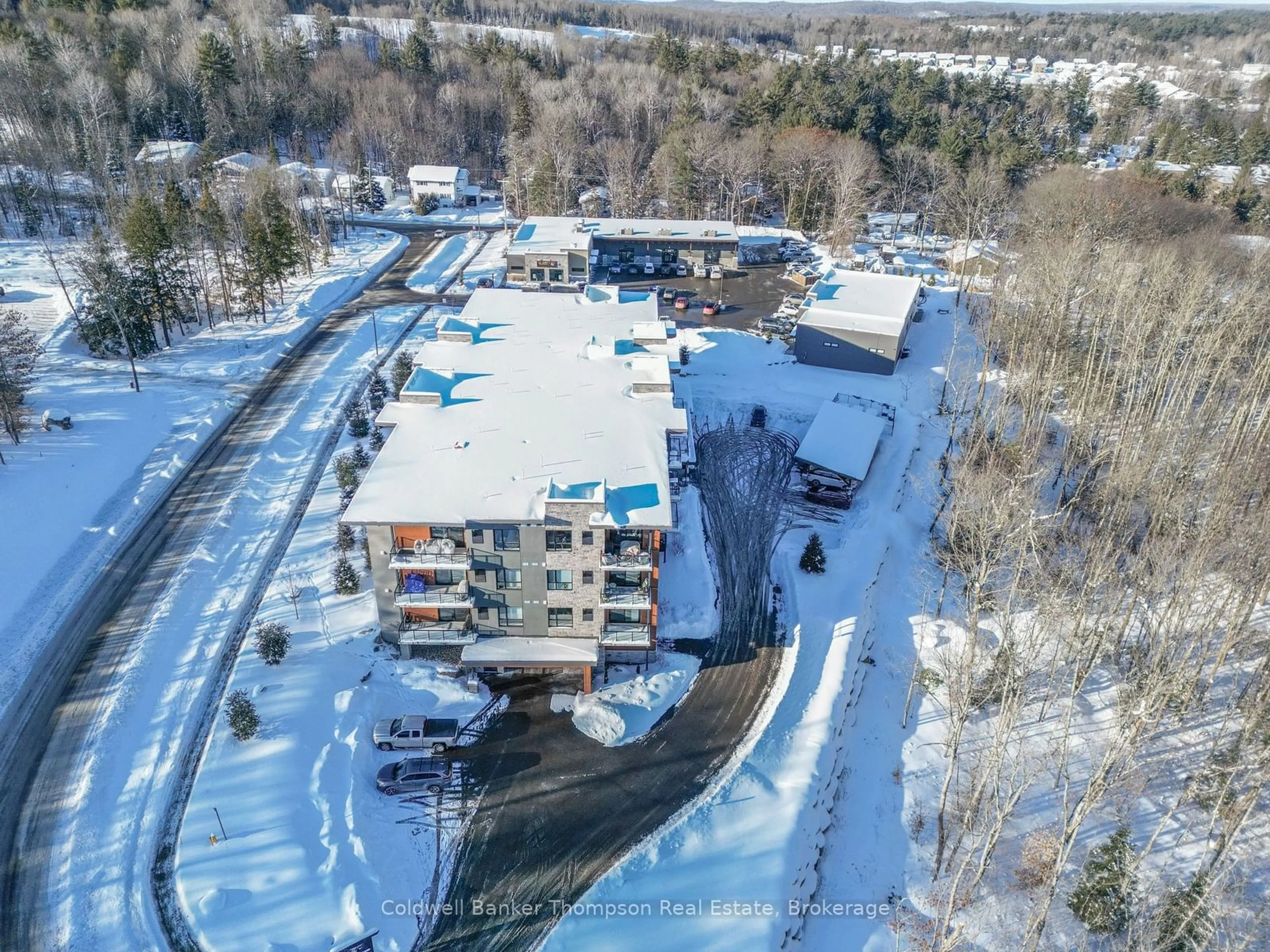 A pic from outside/outdoor area/front of a property/back of a property/a pic from drone, unknown for 23 Campus Tr #202, Huntsville Ontario P1H 0G1