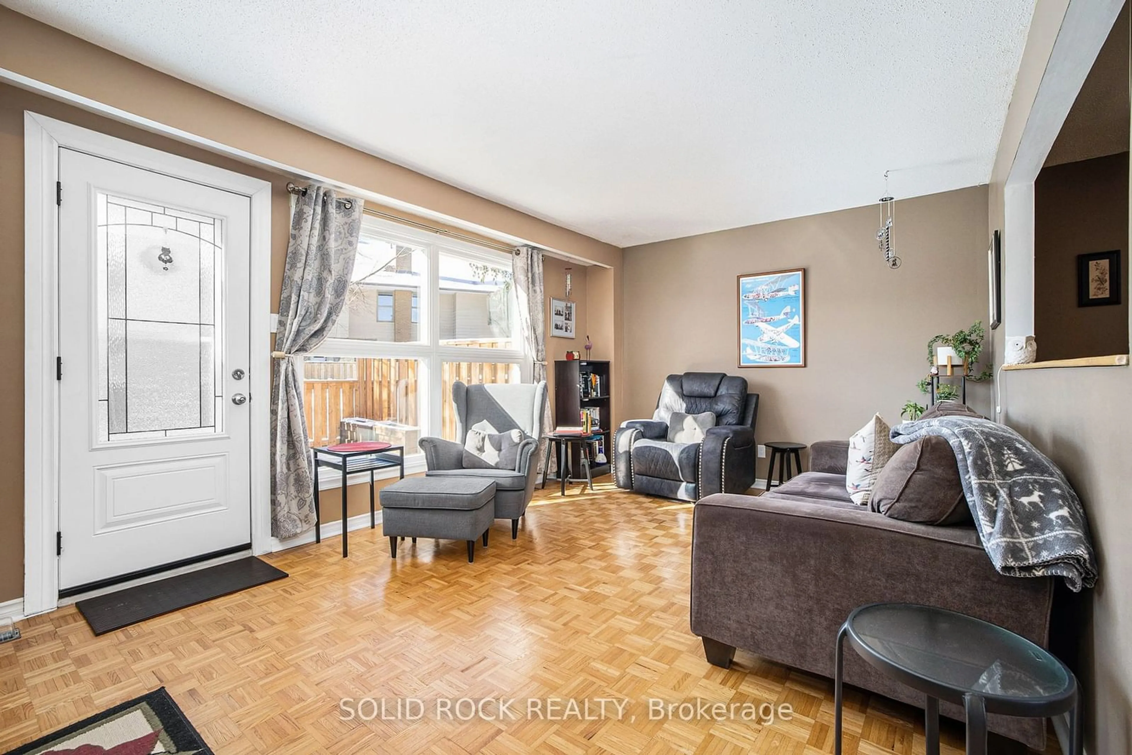 Living room with furniture, wood/laminate floor for 13 Carmichael Crt, Kanata Ontario K2K 1K1