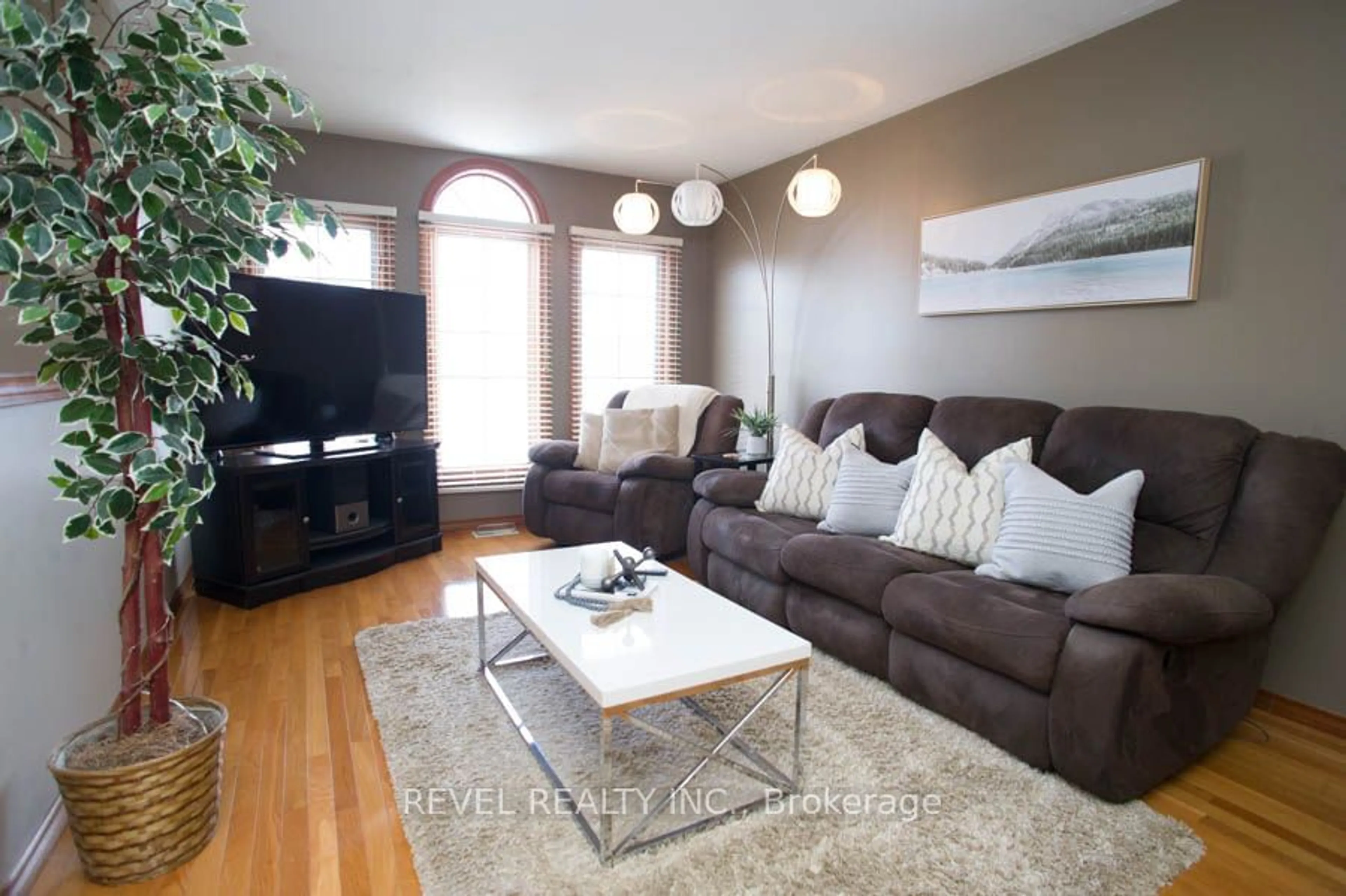 Living room with furniture, wood/laminate floor for 23 Garner's Lane, Brantford Ontario N3T 6M4