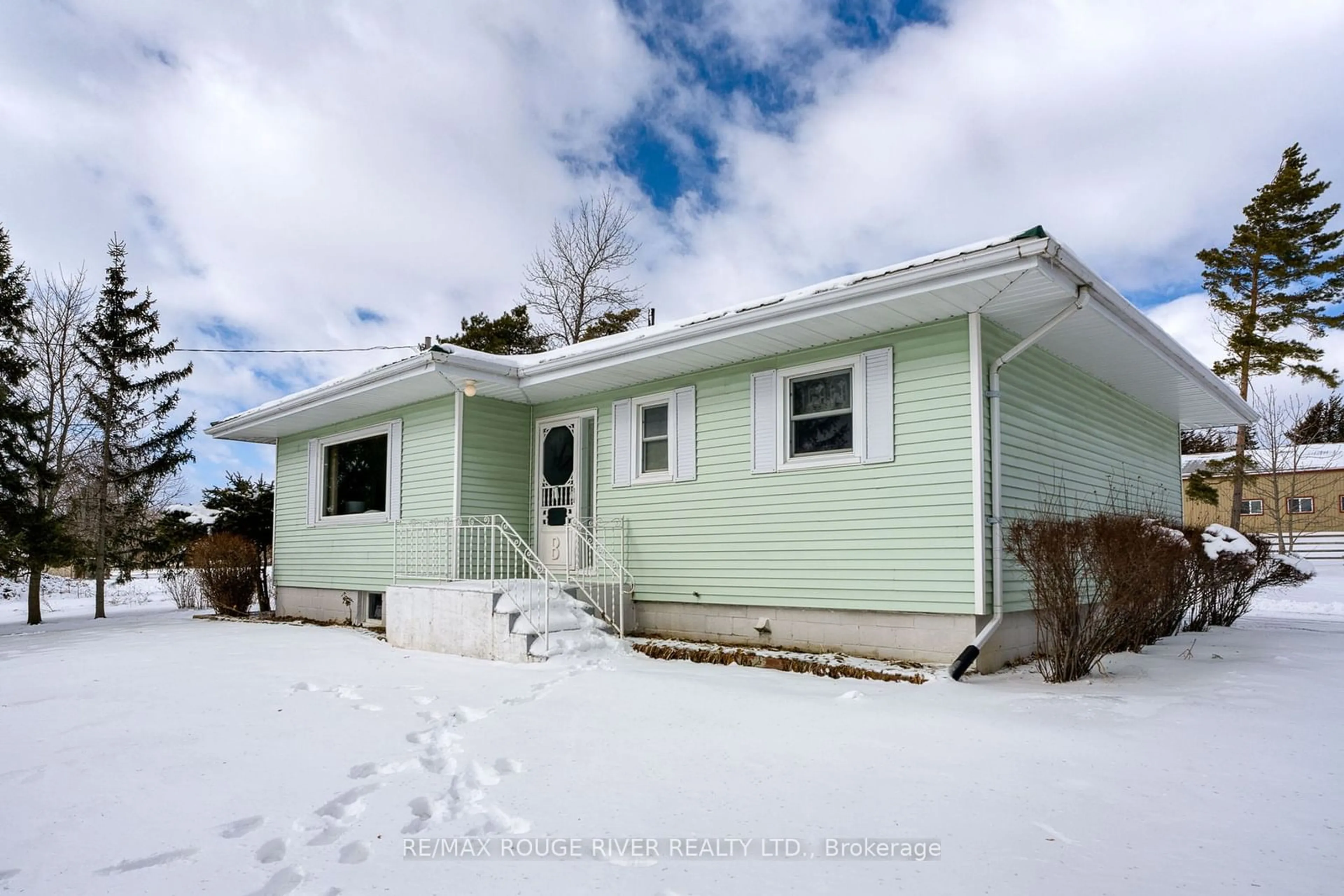 Home with vinyl exterior material, street for 1017 S. Big Island Rd, Prince Edward County Ontario K0K 1W0