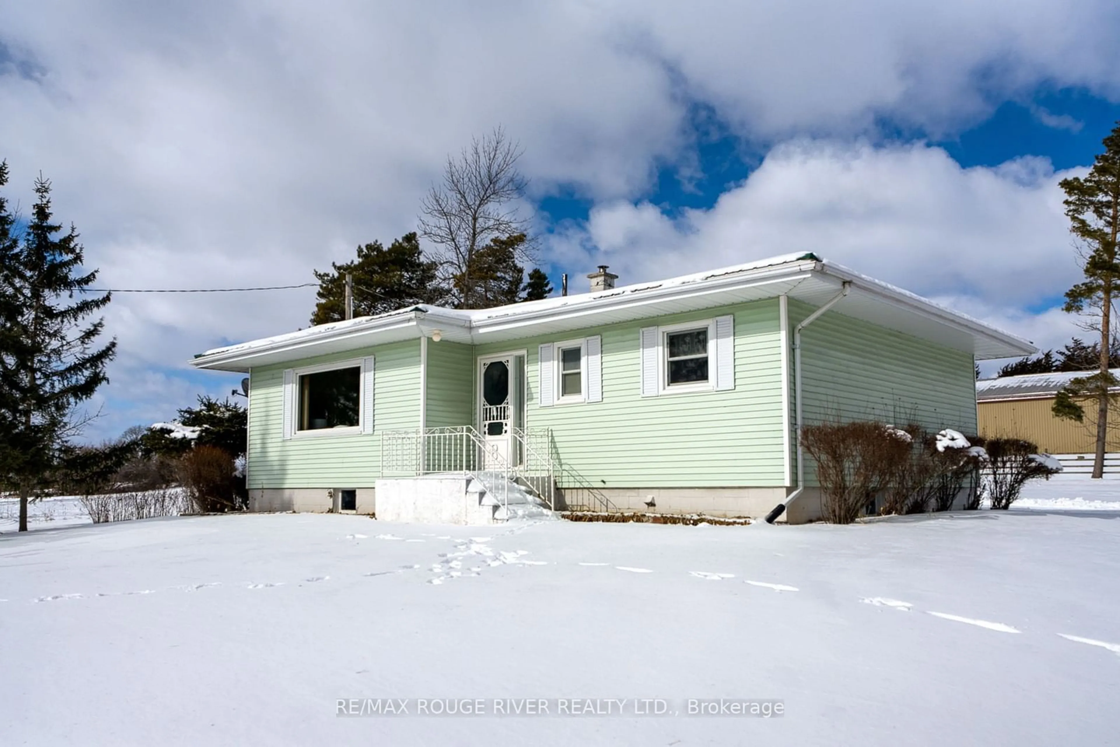 Home with vinyl exterior material, street for 1017 S. Big Island Rd, Prince Edward County Ontario K0K 1W0