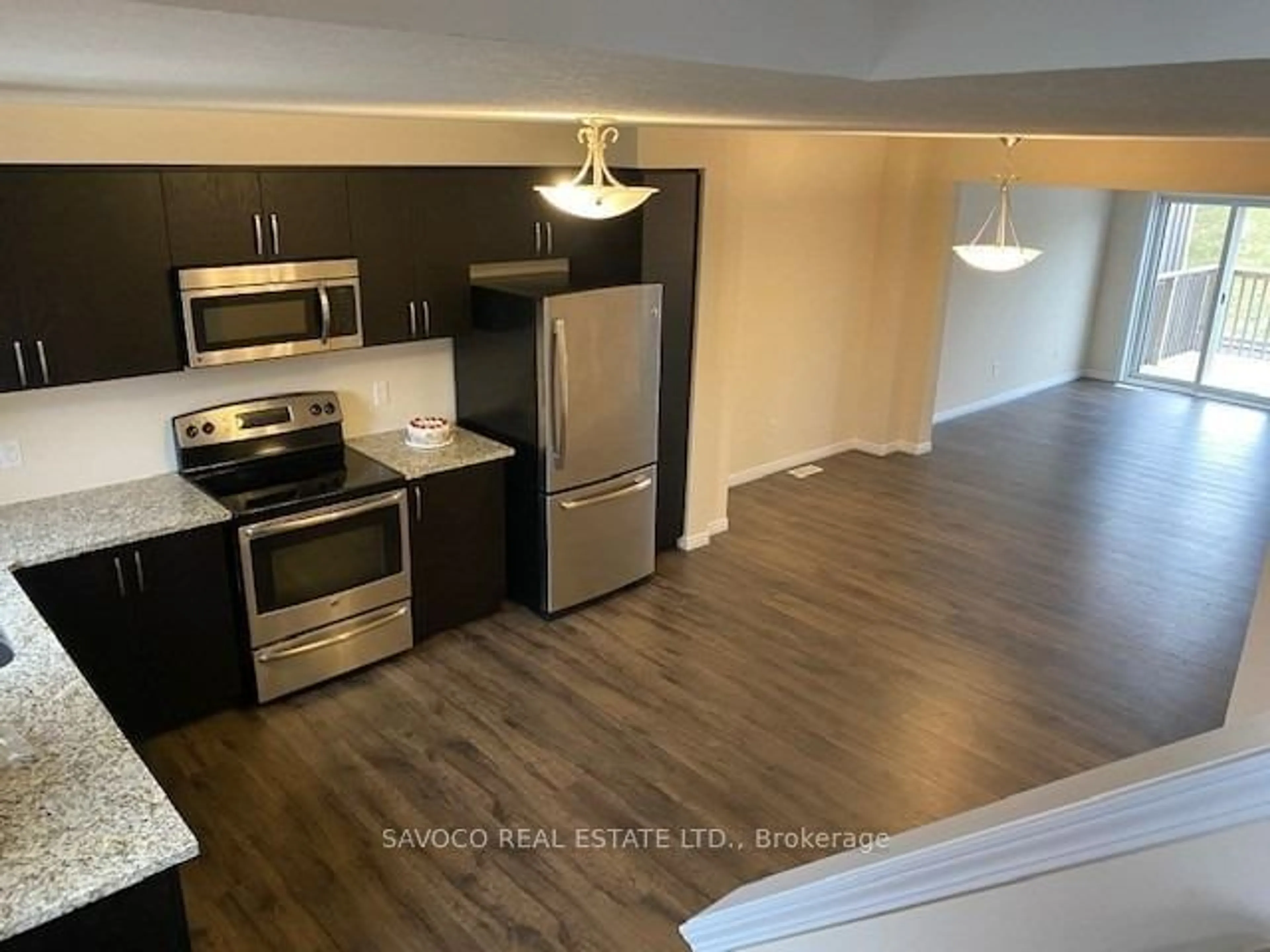 Open concept kitchen, wood/laminate floor for 13 Eliza Ave, Kitchener Ontario N2E 0G2