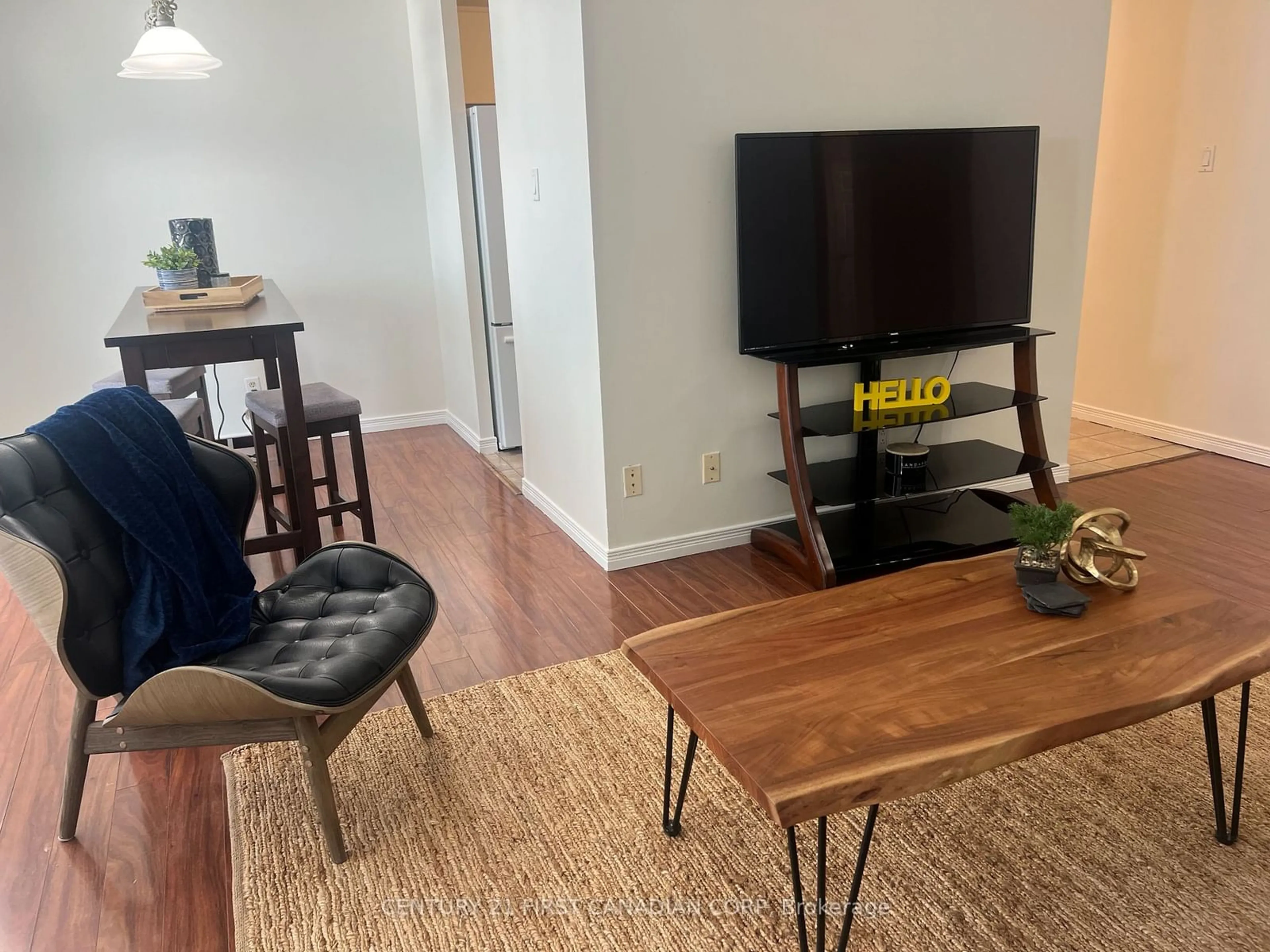 Living room with furniture, wood/laminate floor for 1103 Jalna Blvd #812, London Ontario N6E 2W8