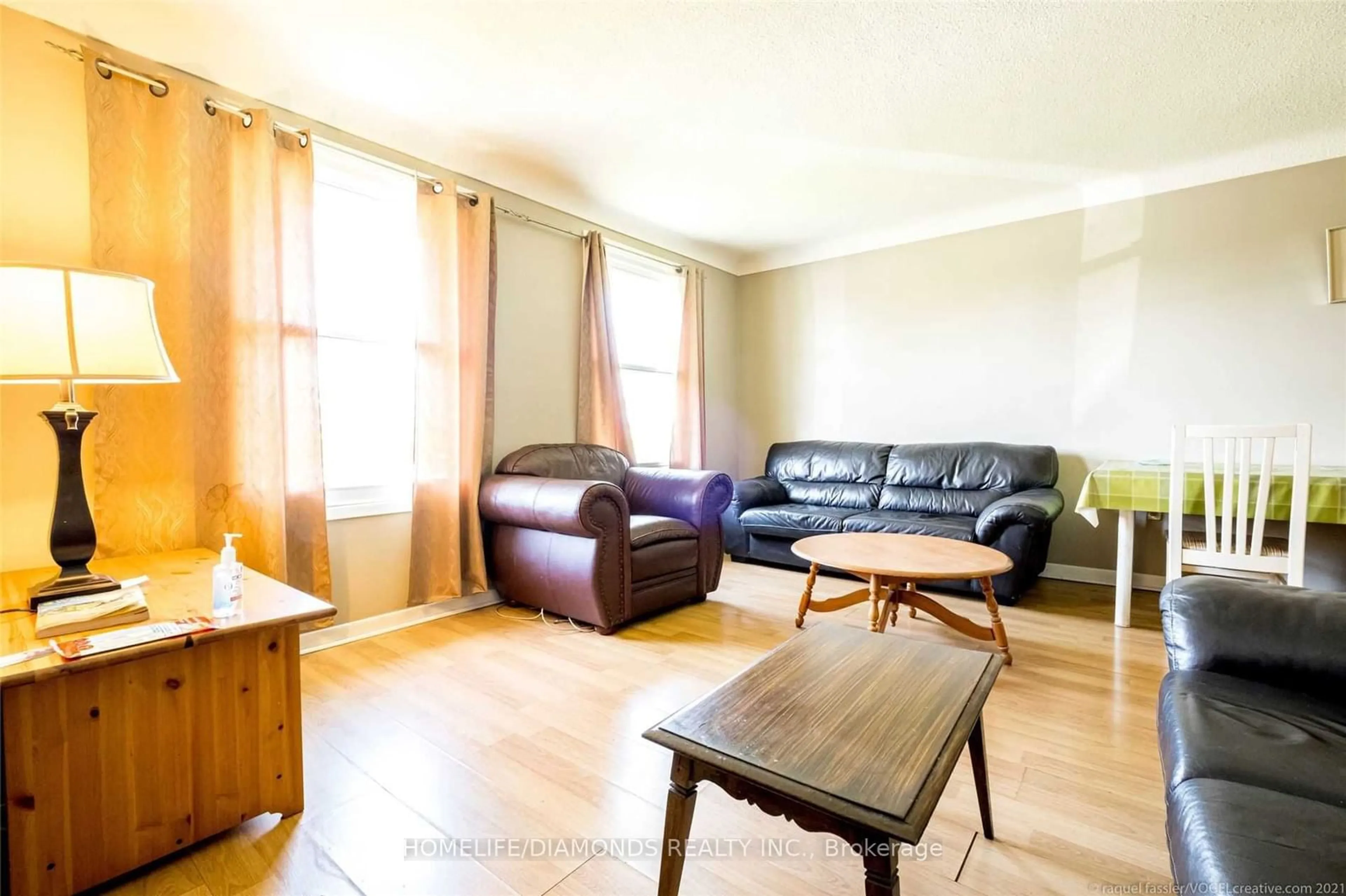 Living room with furniture, wood/laminate floor for 504 First Ave, Welland Ontario L3C 6A7