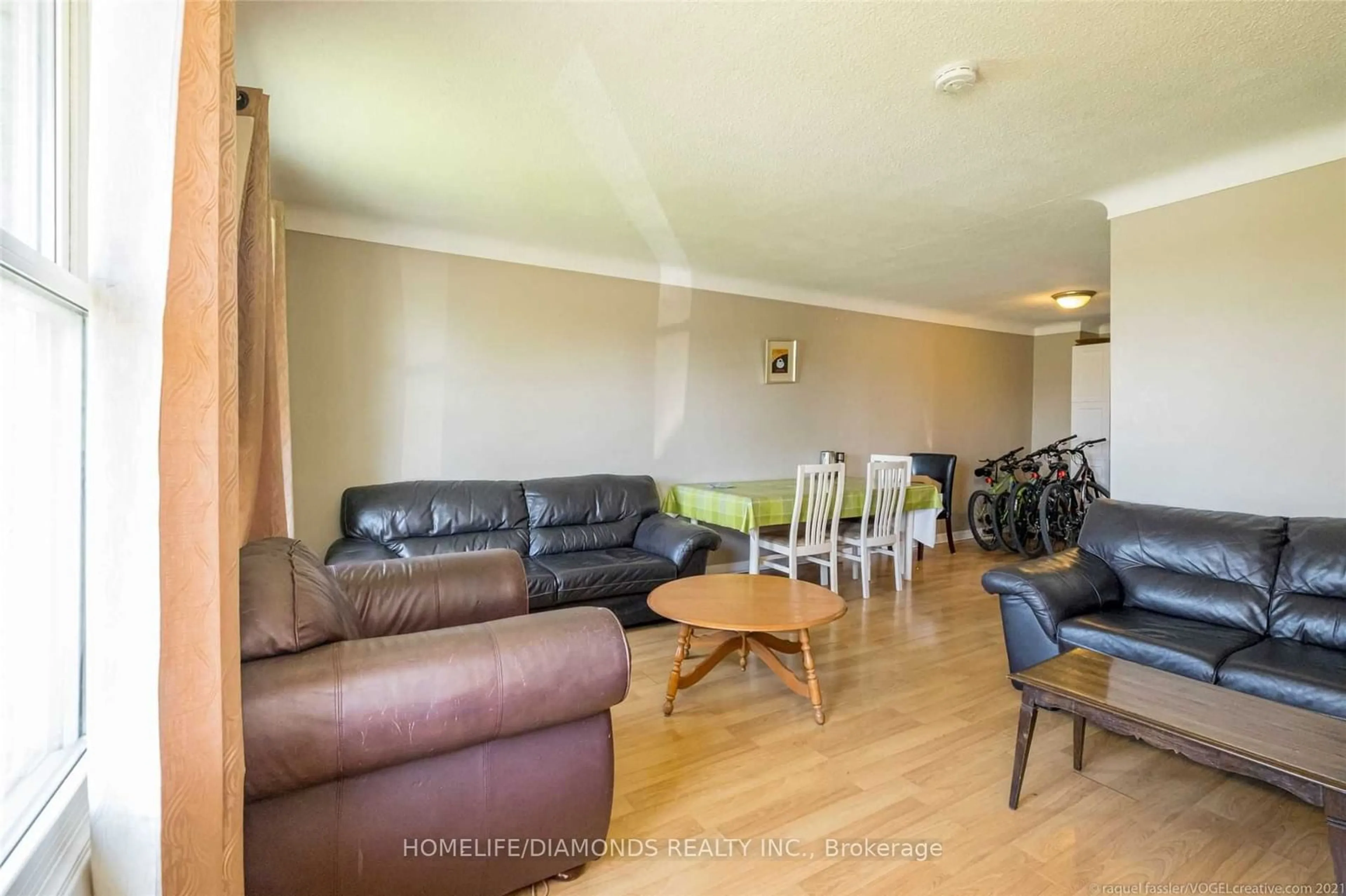 Living room with furniture, wood/laminate floor for 504 First Ave, Welland Ontario L3C 6A7