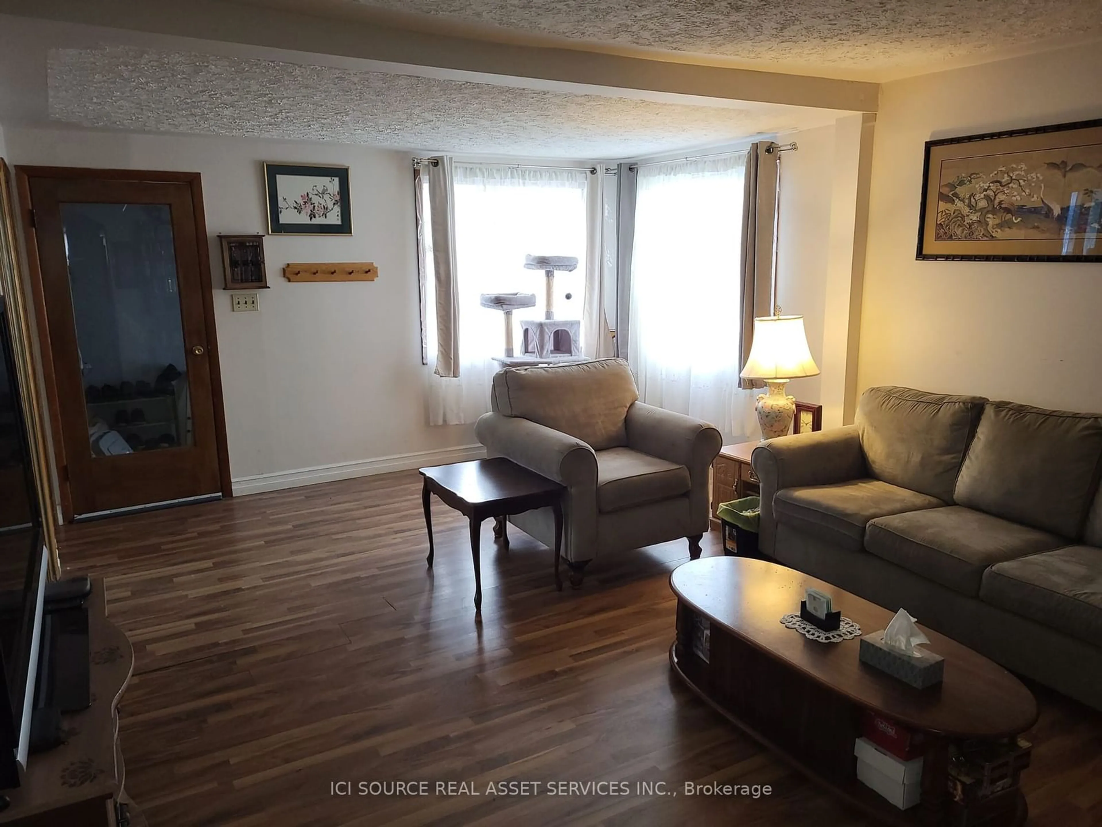 Living room with furniture, wood/laminate floor for 209 Walker St, Schreiber Ontario P0T 2S0