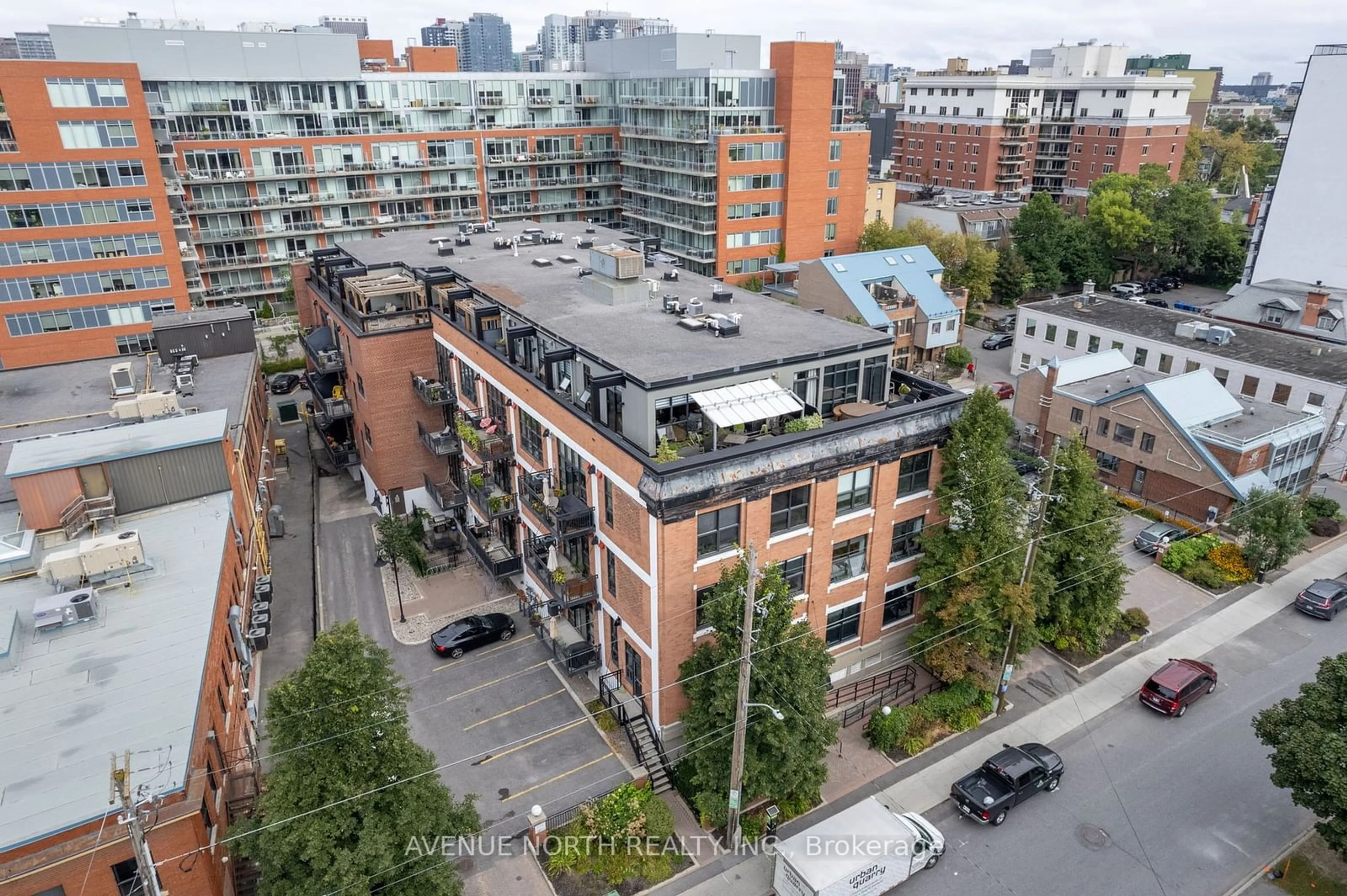 A pic from outside/outdoor area/front of a property/back of a property/a pic from drone, city buildings view from balcony for 255 Argyle Ave #105, Ottawa Centre Ontario K2P 2N7