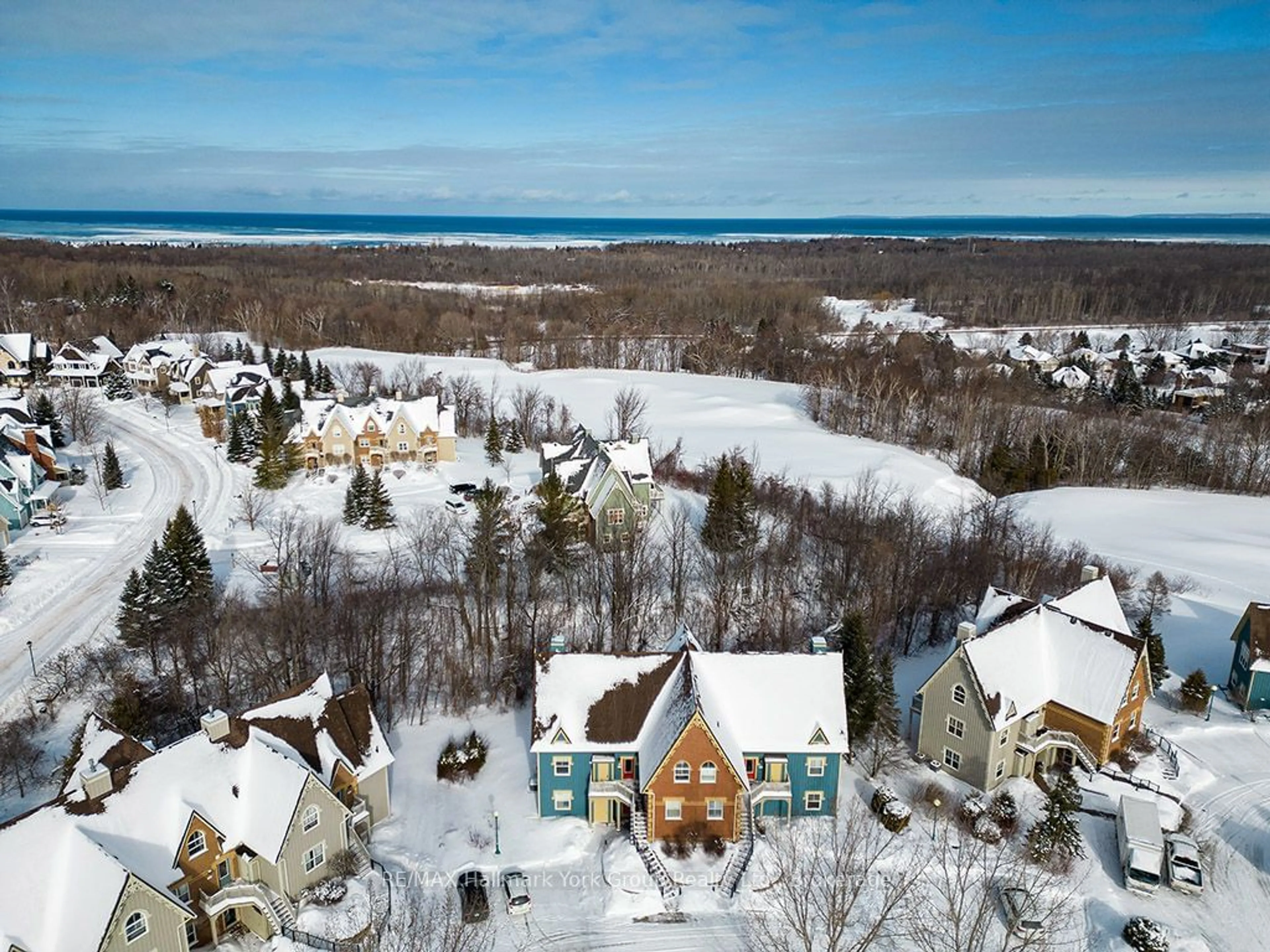 A pic from outside/outdoor area/front of a property/back of a property/a pic from drone, water/lake/river/ocean view for 184 Snowbridge Way #217, Blue Mountains Ontario L9Y 0V1