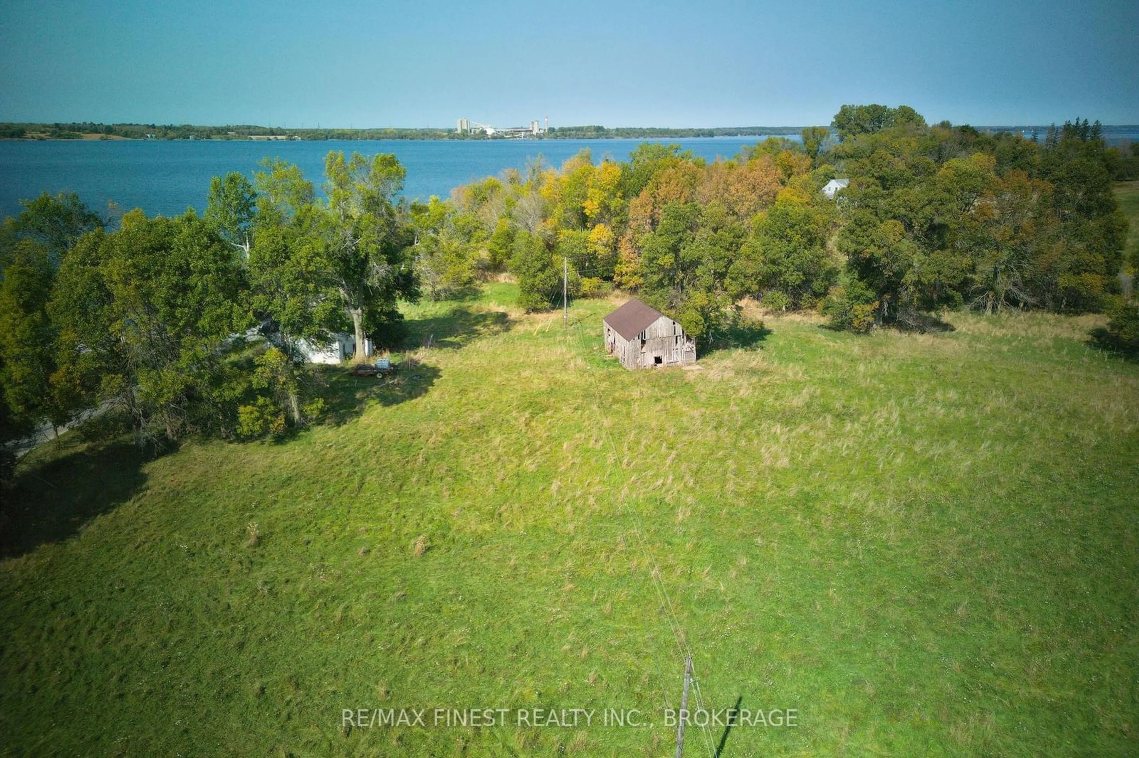 A pic from outside/outdoor area/front of a property/back of a property/a pic from drone, water/lake/river/ocean view for 15355 FRONT Rd, Stella Ontario K0H 2S0