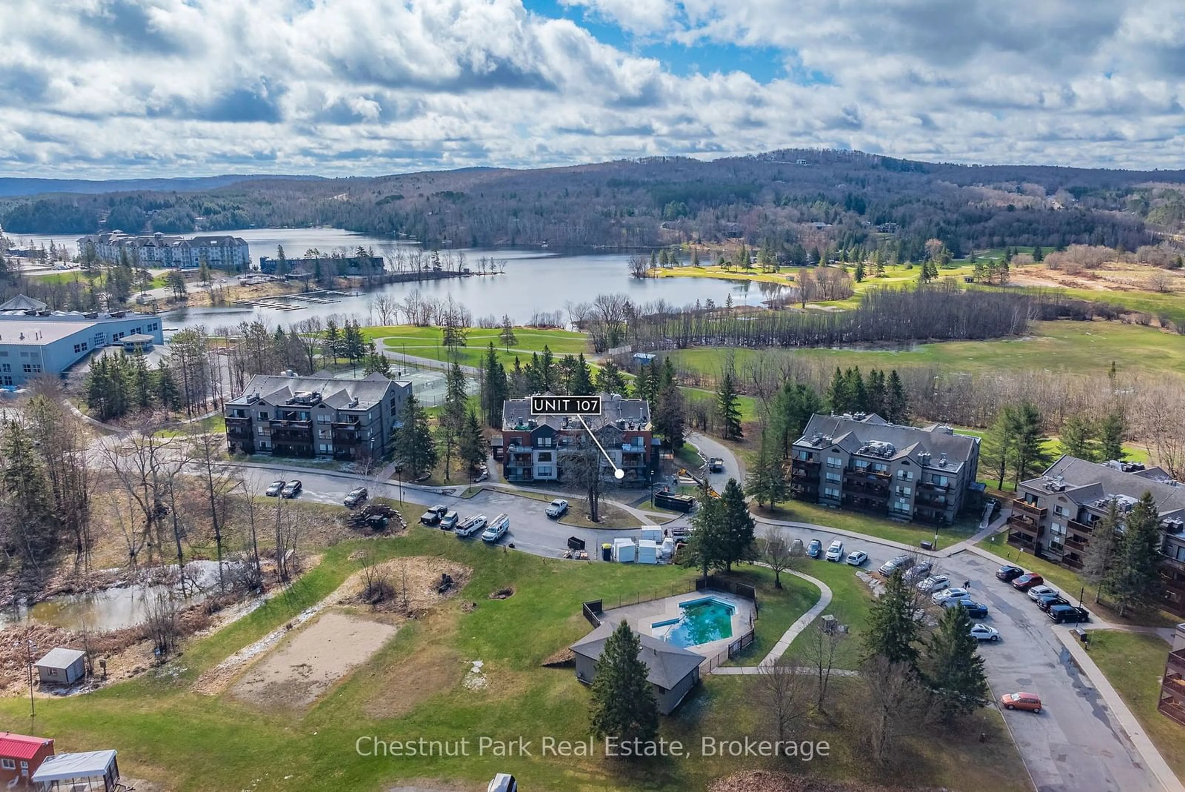 A pic from outside/outdoor area/front of a property/back of a property/a pic from drone, water/lake/river/ocean view for 1235 DEERHURST Dr #52-107, Huntsville Ontario P1H 2E8