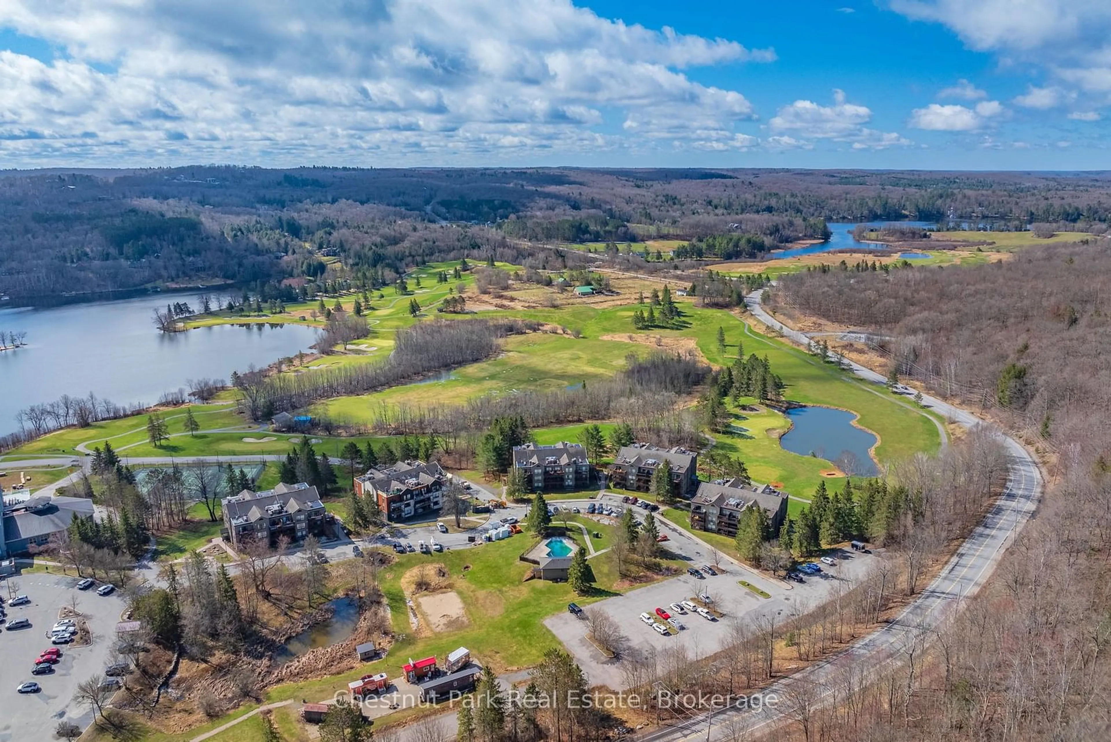 A pic from outside/outdoor area/front of a property/back of a property/a pic from drone, water/lake/river/ocean view for 1235 DEERHURST Dr #52-107, Huntsville Ontario P1H 2E8