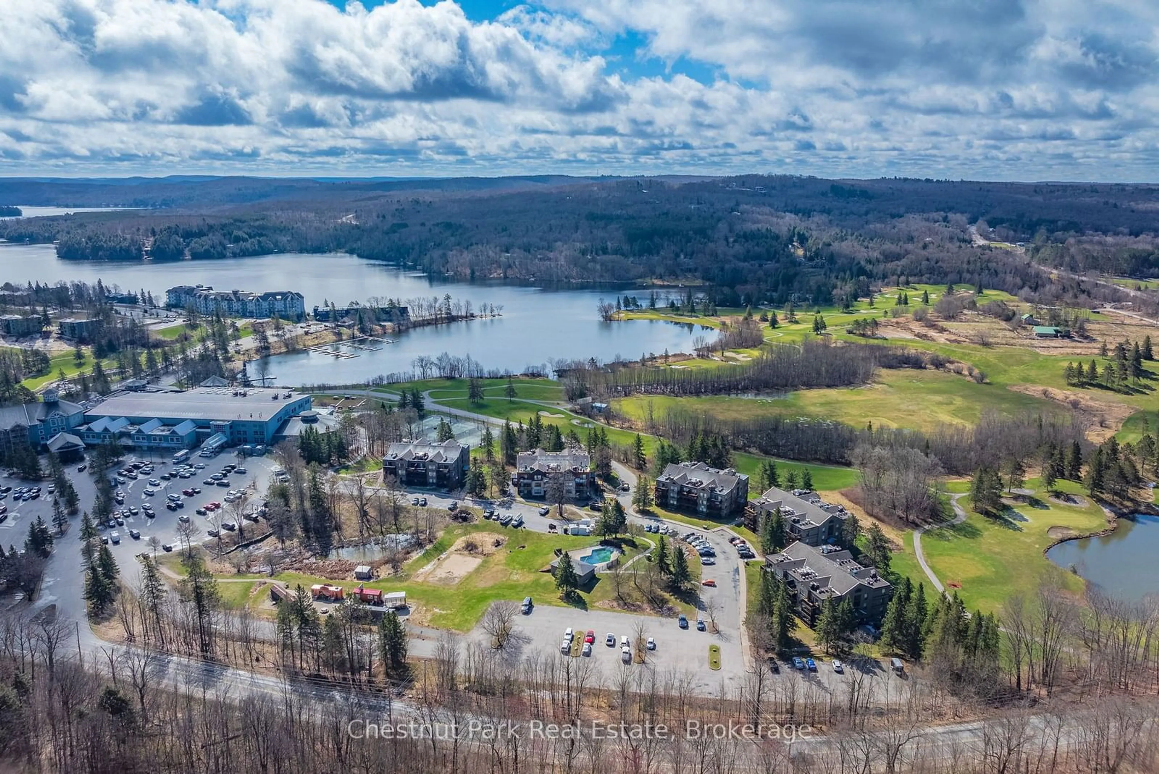 A pic from outside/outdoor area/front of a property/back of a property/a pic from drone, water/lake/river/ocean view for 1235 DEERHURST Dr #52-107, Huntsville Ontario P1H 2E8