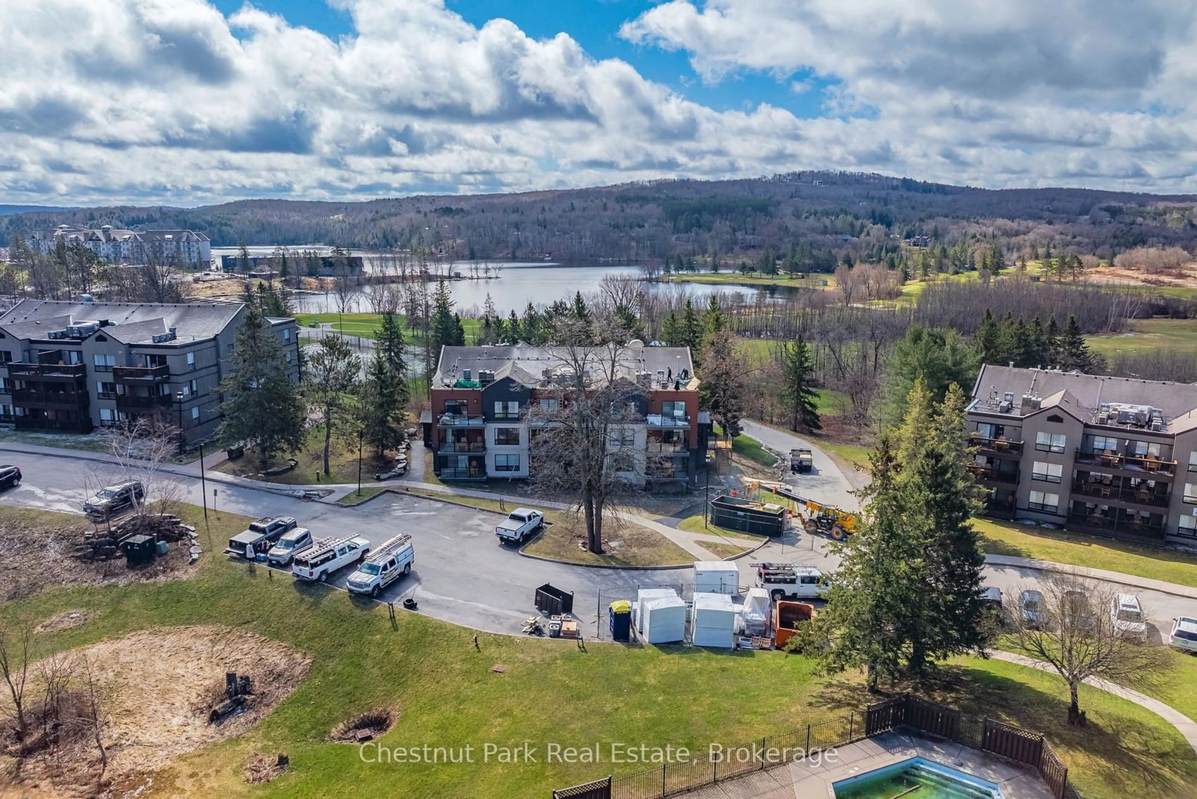 A pic from outside/outdoor area/front of a property/back of a property/a pic from drone, water/lake/river/ocean view for 1235 DEERHURST Dr #52-107, Huntsville Ontario P1H 2E8