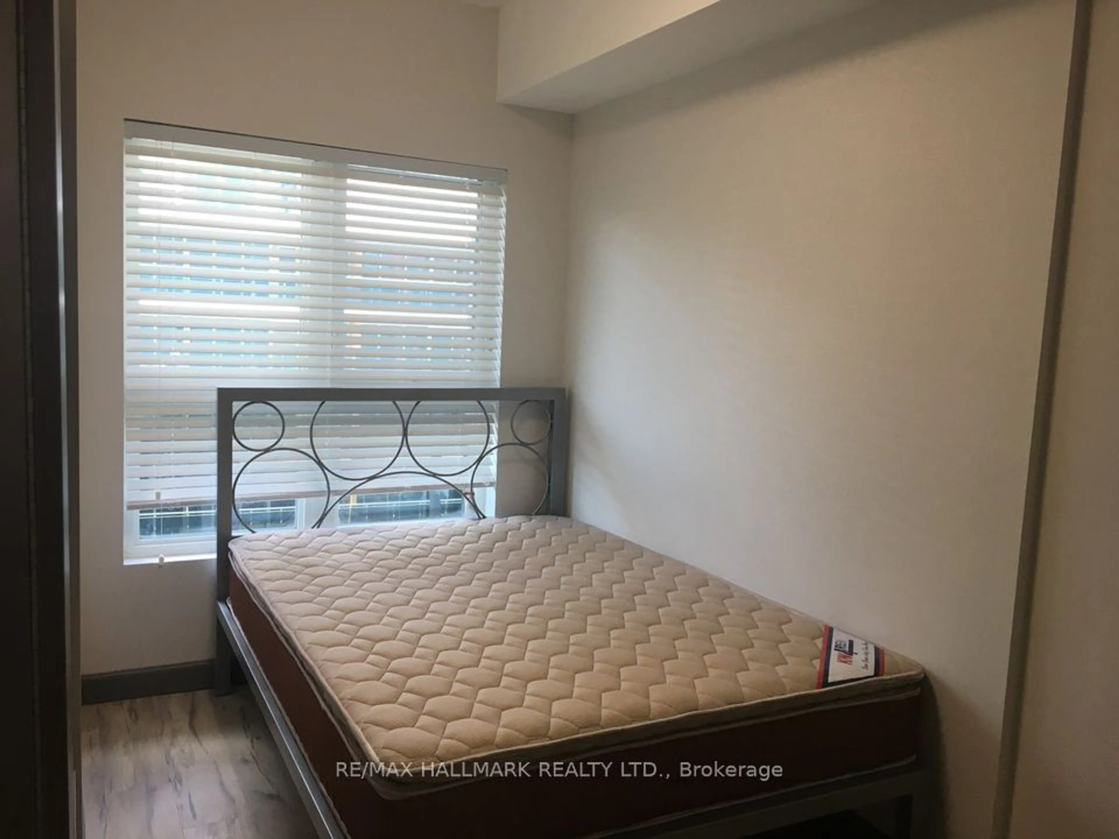 Bedroom with bed, wood/laminate floor for 258B Sunview St #278, Waterloo Ontario N2L 0H7