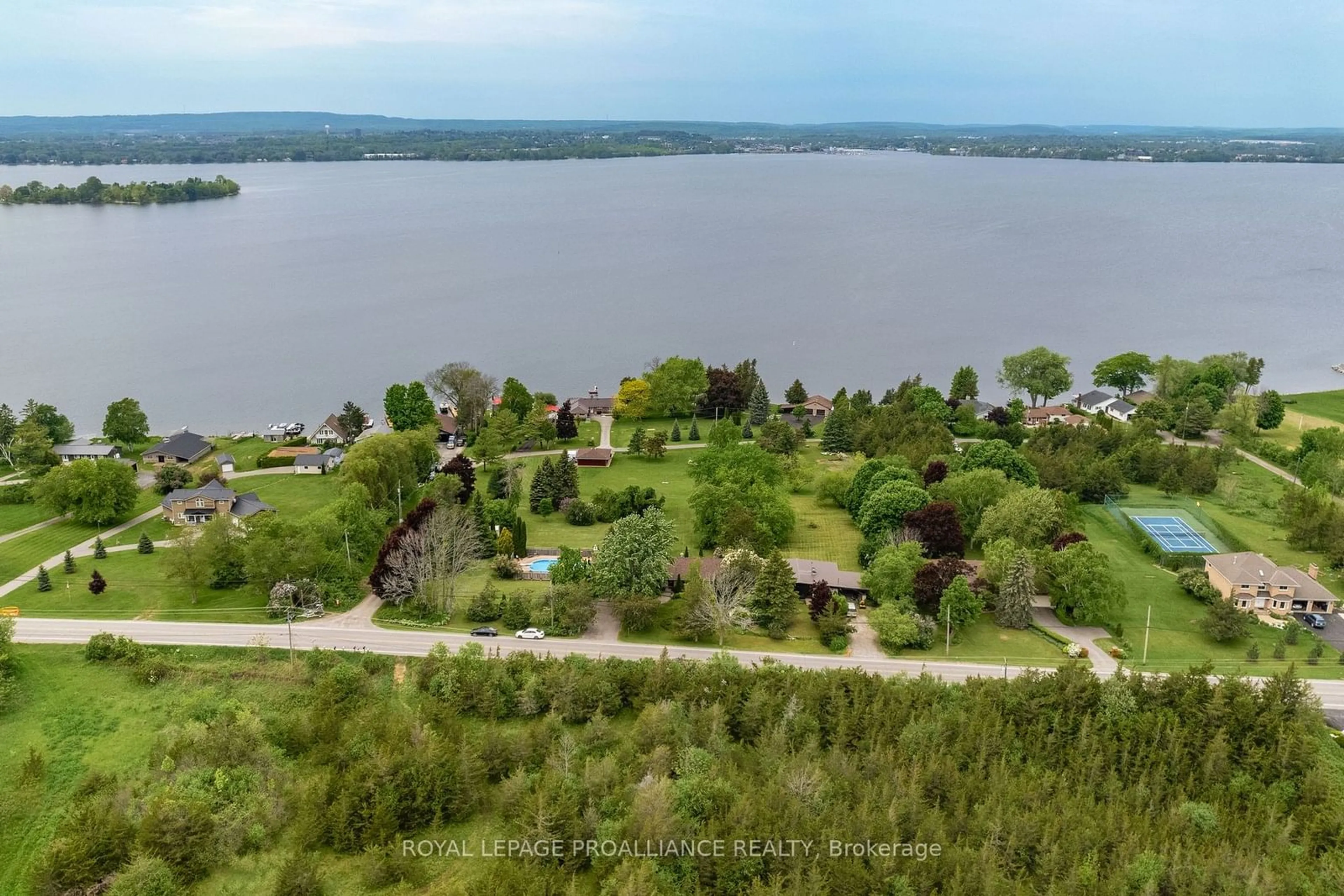 A pic from outside/outdoor area/front of a property/back of a property/a pic from drone, water/lake/river/ocean view for 3286 County Road 3, Prince Edward County Ontario K0K 1L0