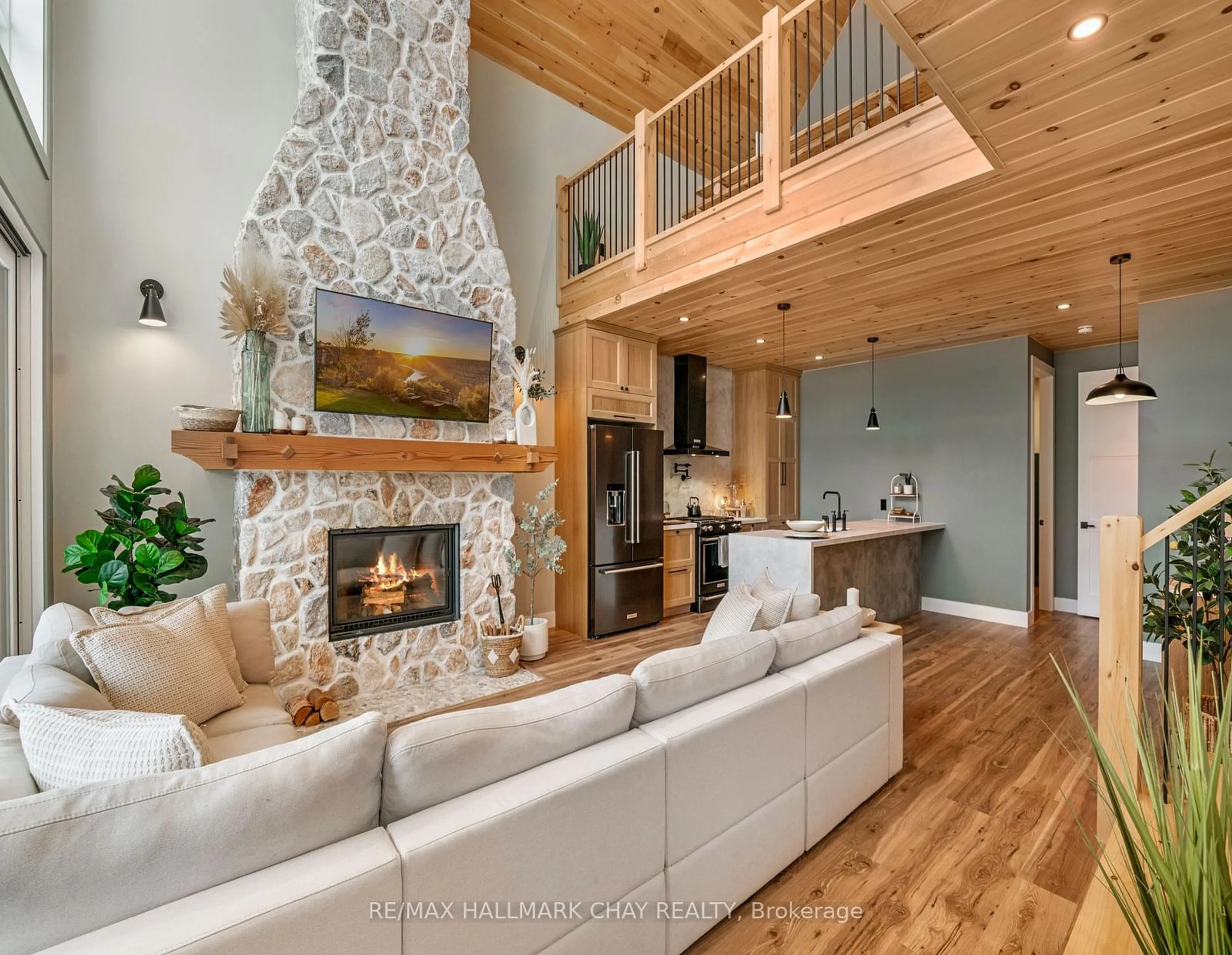 Living room with furniture, wood/laminate floor for 199 Musquash Rd, Gravenhurst Ontario P1P 0E8