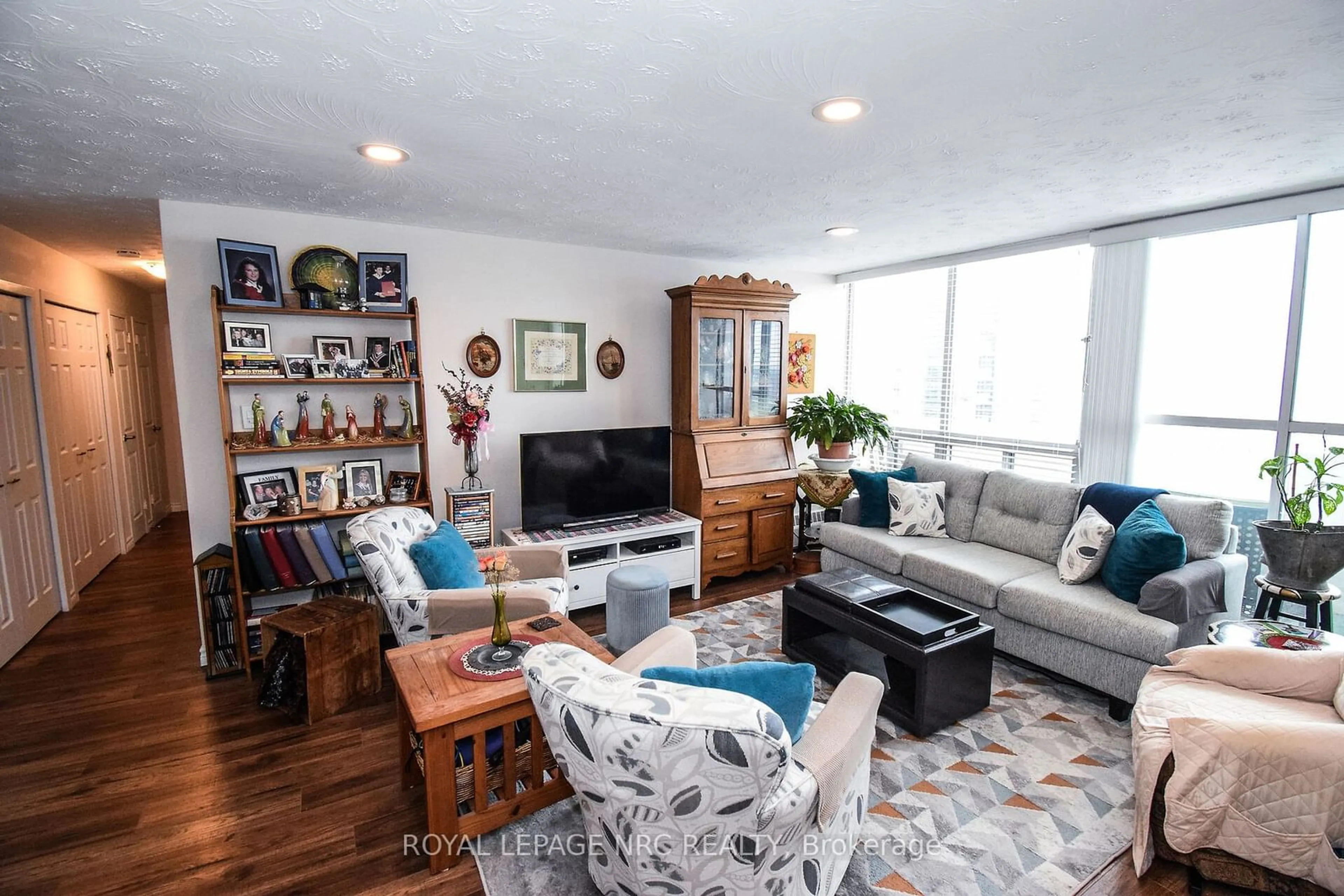 Living room with furniture, wood/laminate floor for 35 Towering Heights Blvd #1107, St. Catharines Ontario L2T 3G8