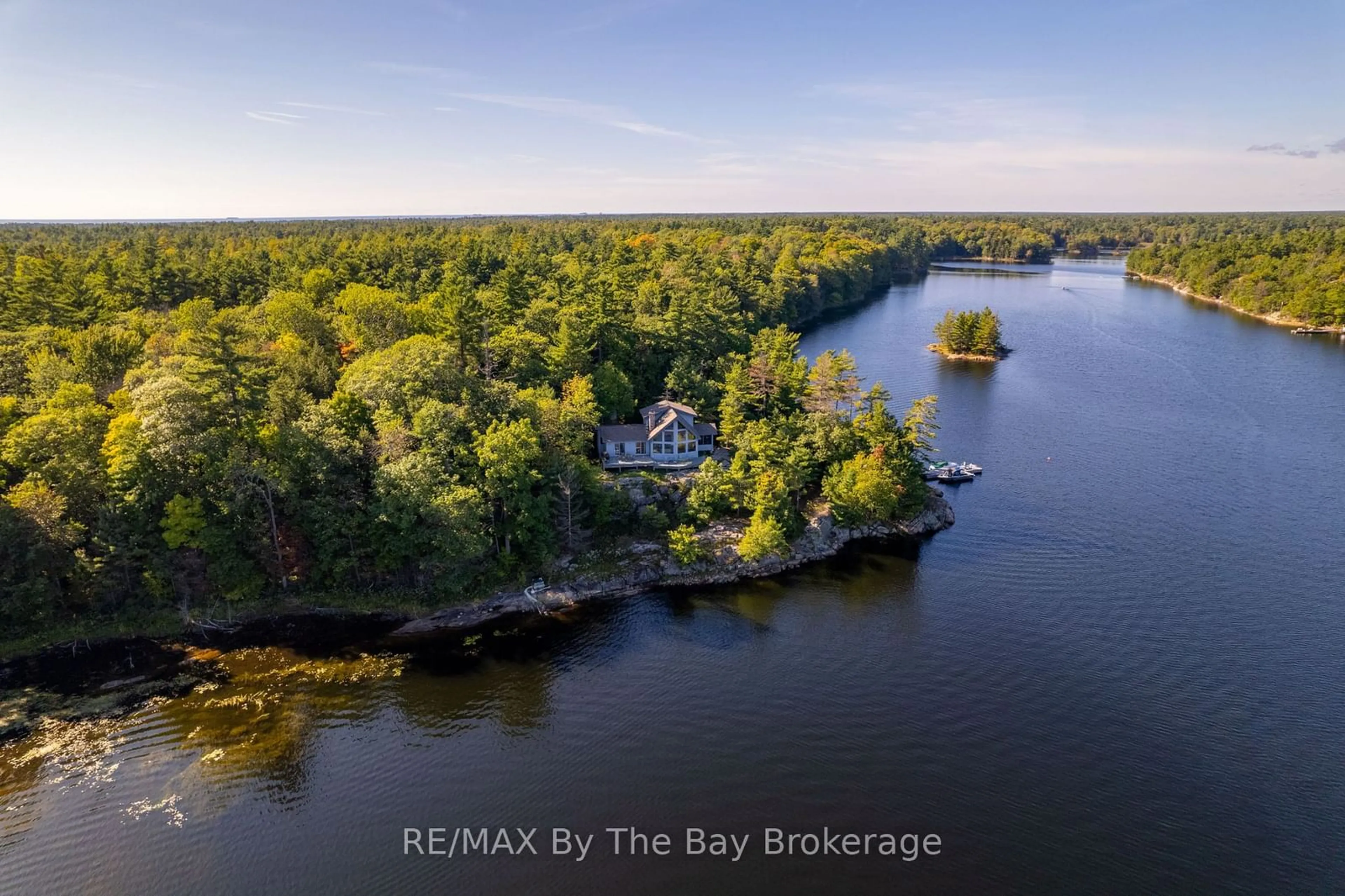 A pic from outside/outdoor area/front of a property/back of a property/a pic from drone, water/lake/river/ocean view for 23212 Georgian Bay Shr, Georgian Bay Ontario P0E 1E0