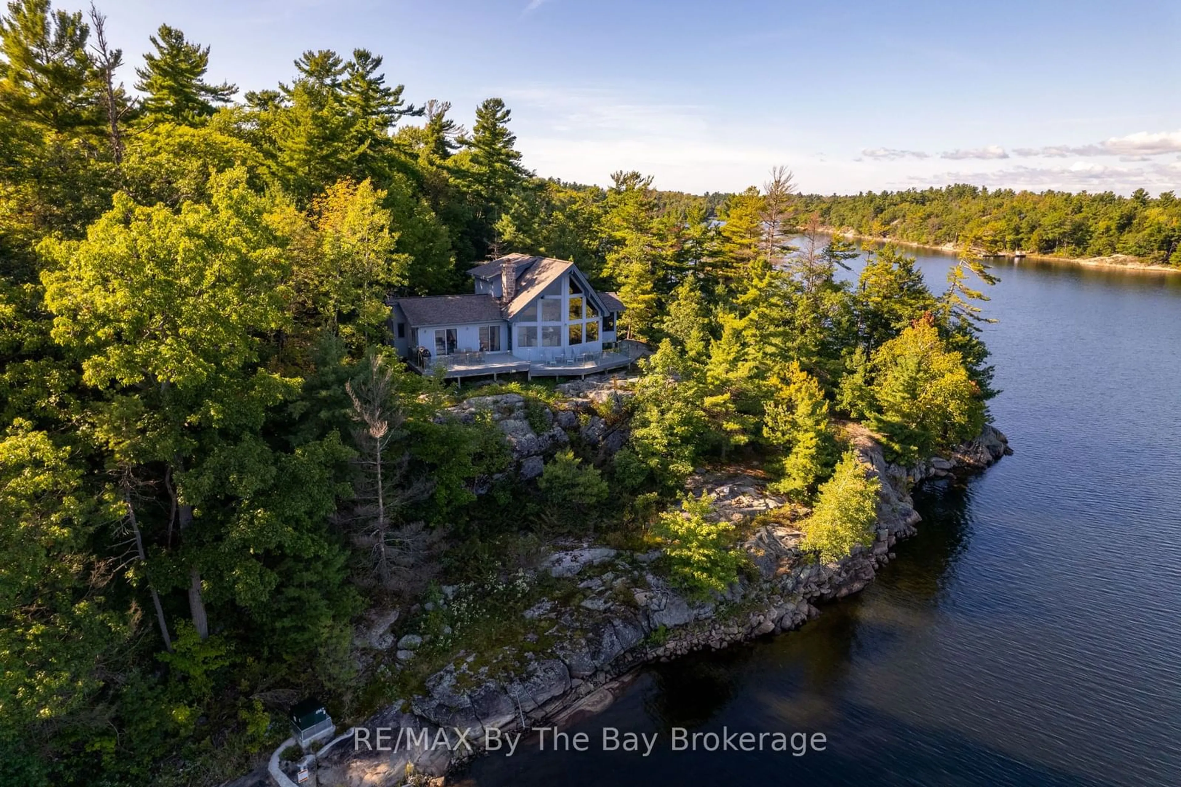 A pic from outside/outdoor area/front of a property/back of a property/a pic from drone, water/lake/river/ocean view for 23212 Georgian Bay Shr, Georgian Bay Ontario P0E 1E0