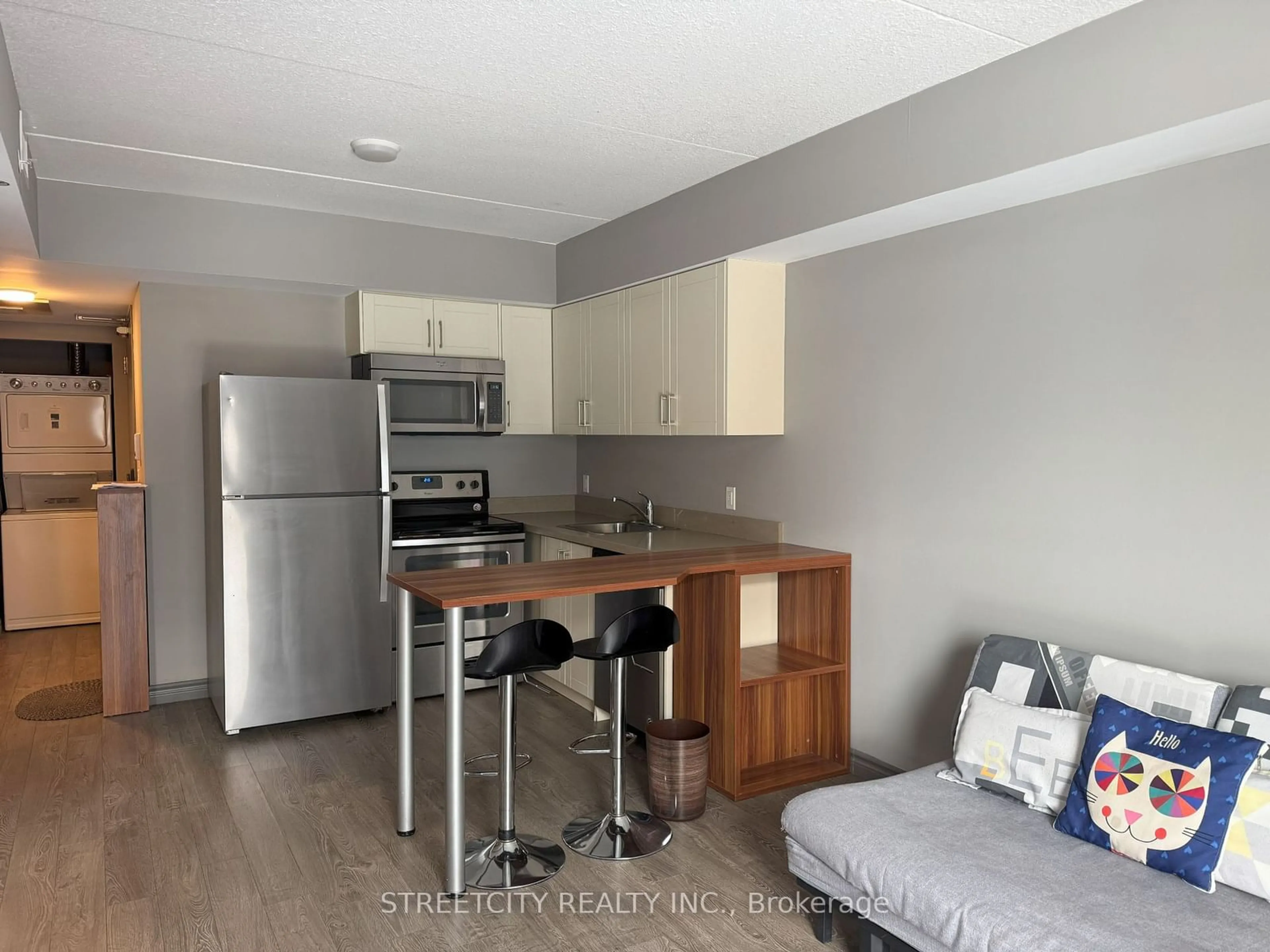 Open concept kitchen, wood/laminate floor for 321 Spruce St #501, Waterloo Ontario N2L 0G4