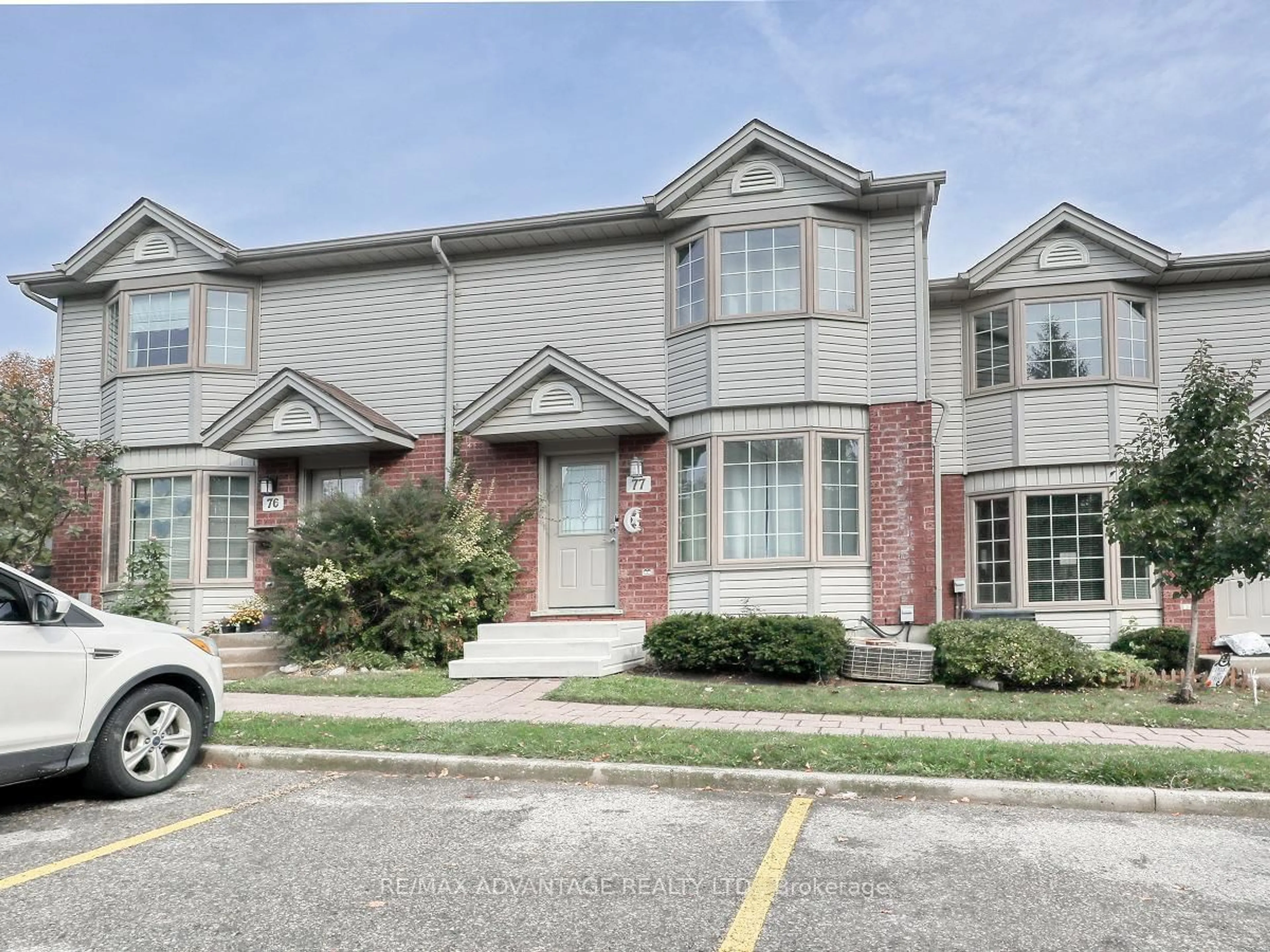 Home with brick exterior material, street for 70 Chapman Crt #77, London Ontario N6G 4Z4