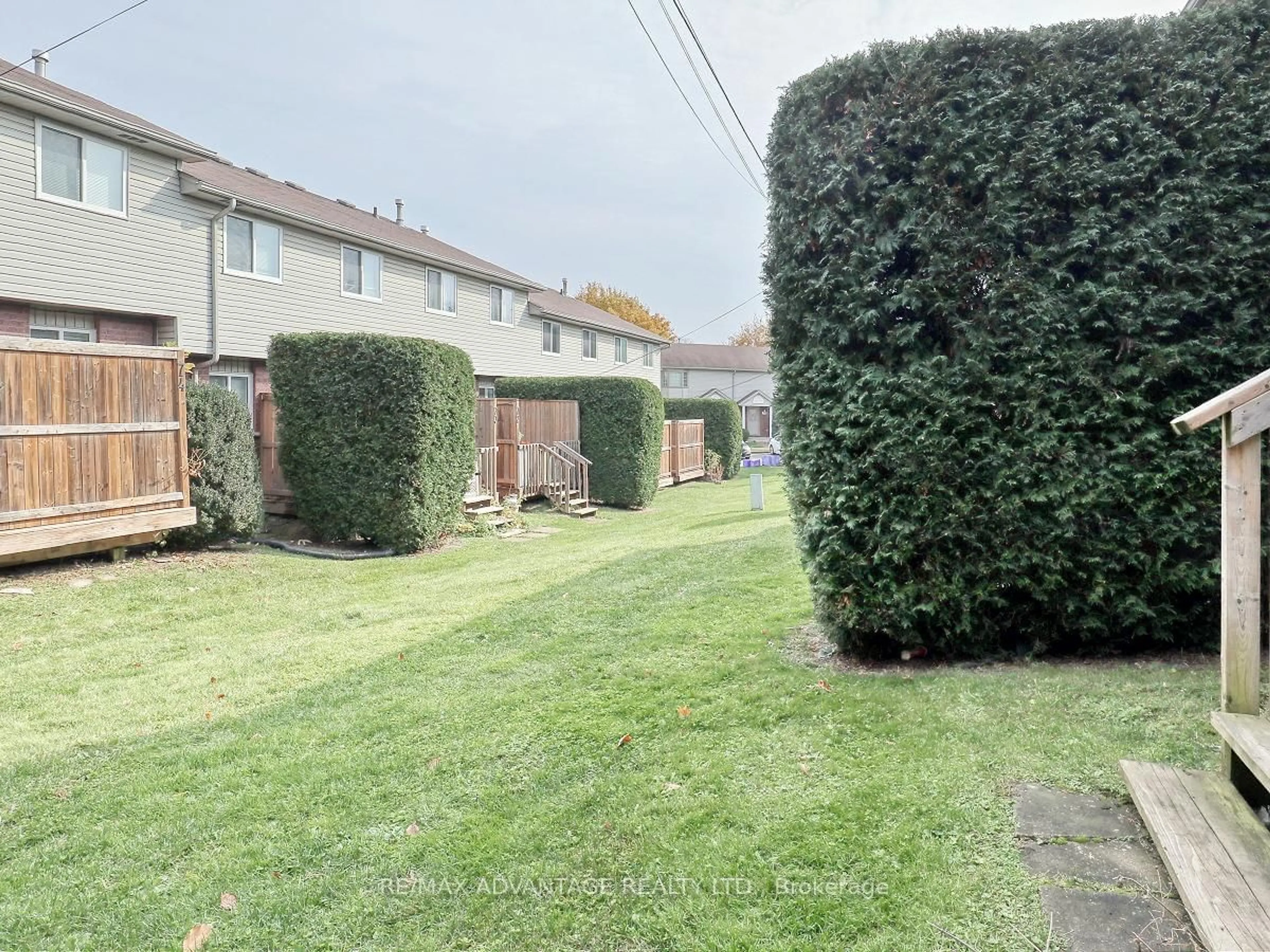 A pic from outside/outdoor area/front of a property/back of a property/a pic from drone, street for 70 Chapman Crt #77, London Ontario N6G 4Z4